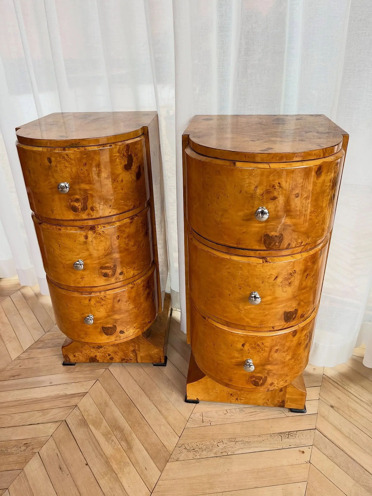 Elegant pair of art deco style walnut burr cabinets. 
These can be bought as a pair or individually. They are actually much larger than they appear.
They would look amazing in a bedroom either side of a full length mirror or in a living room on eithe