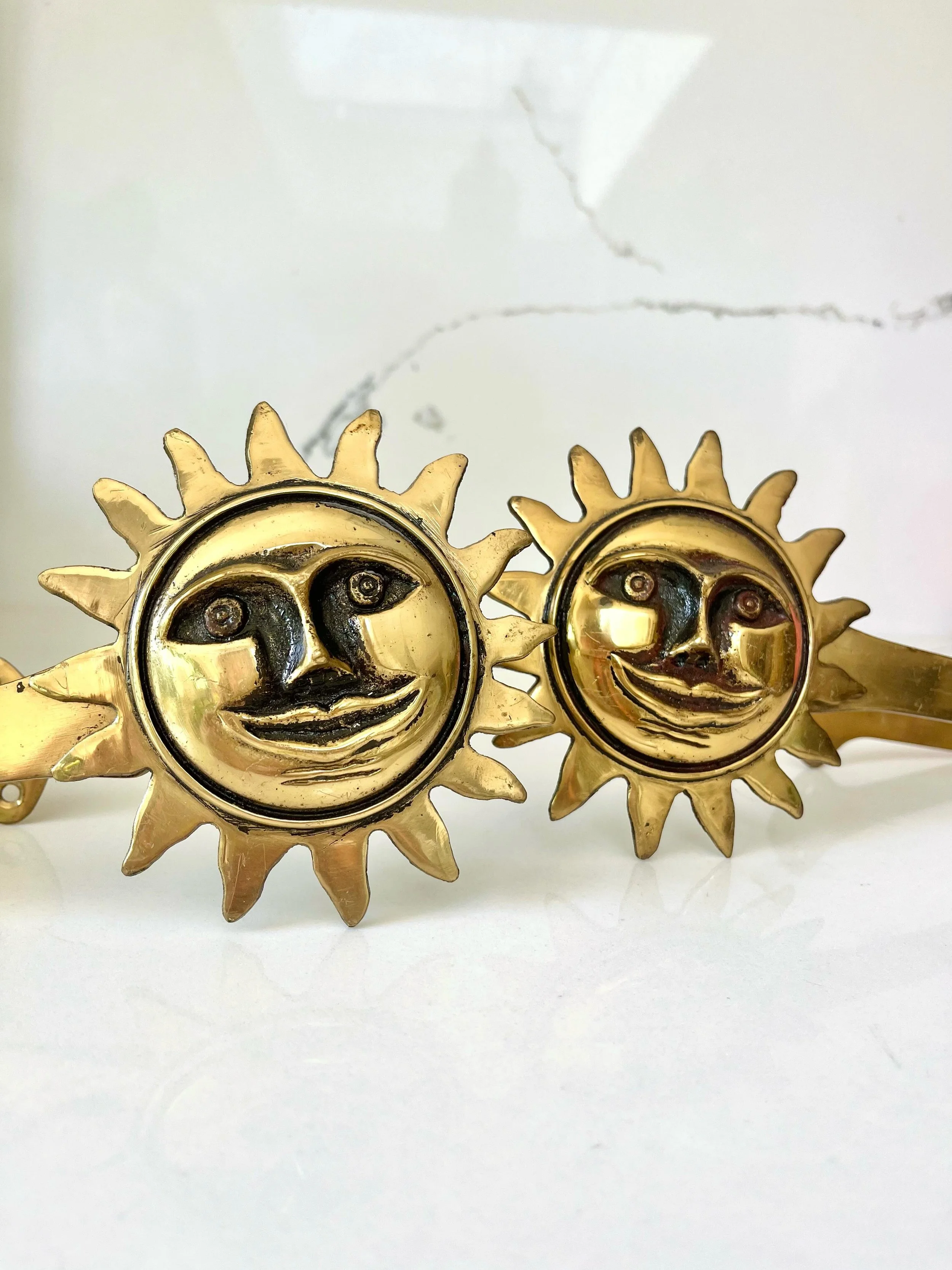 WHERE HAS THE 🌞 GONE 🥺
Pair of Brass Celestial Sun Face Curtain Tie Backs
This sunny pair of smiling brass curtain tie-backs will bring happiness to any interior.
They have a lovely rich patina which only comes with age. Two sets available online