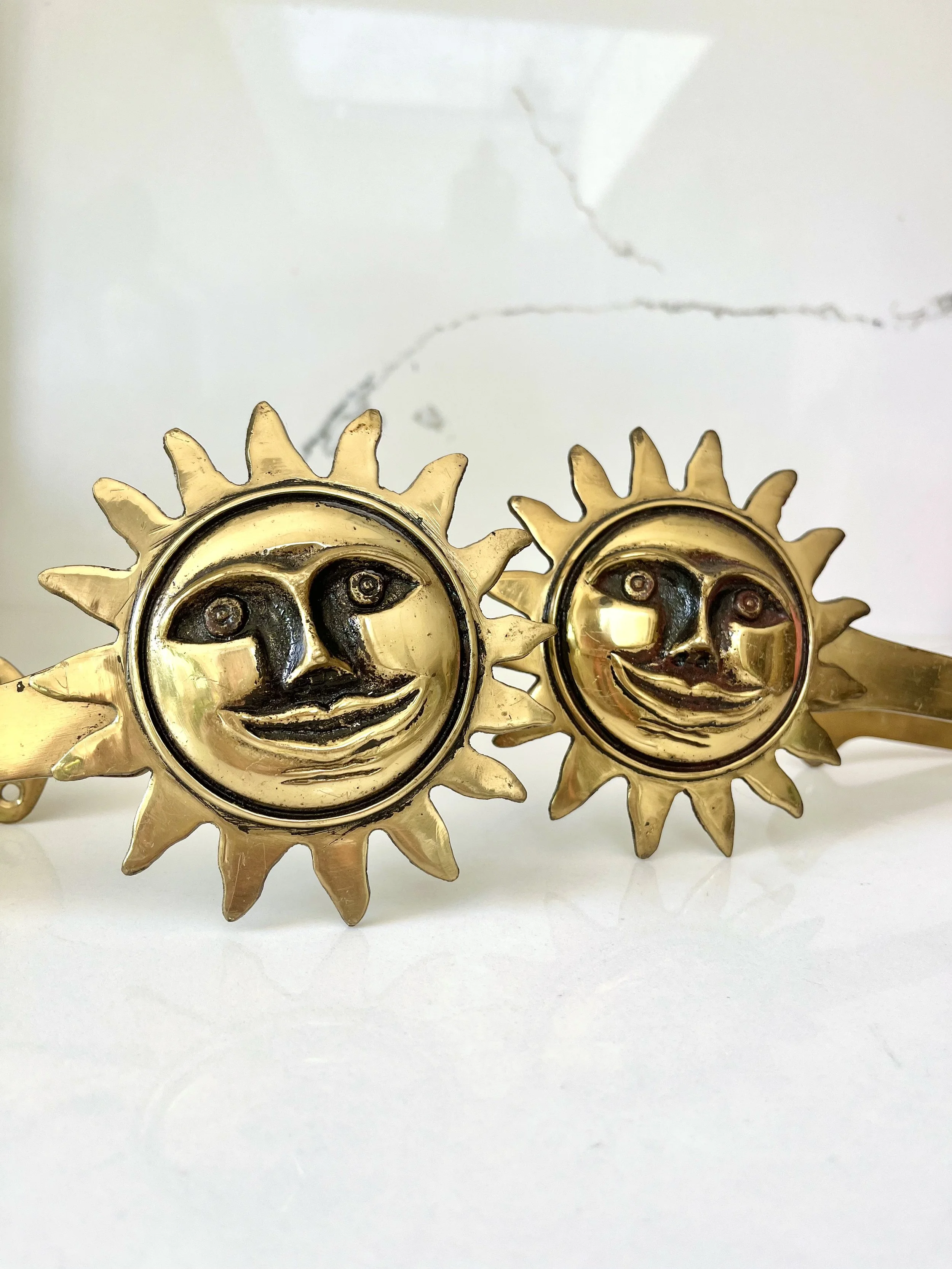 Pair of brass sun face curtain tie backs 9.jpeg
