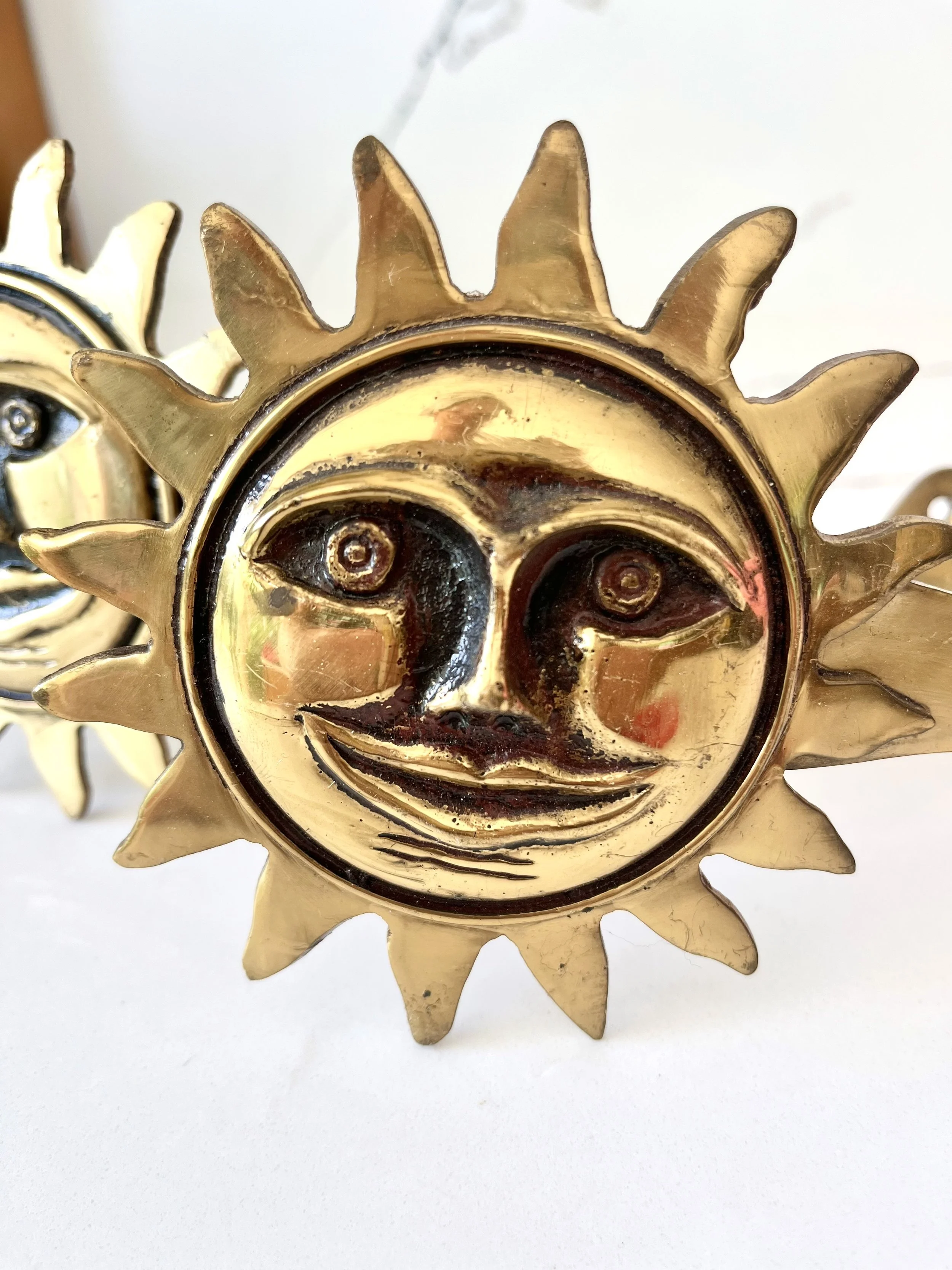 Pair of brass sun face curtain tie backs 5.jpeg