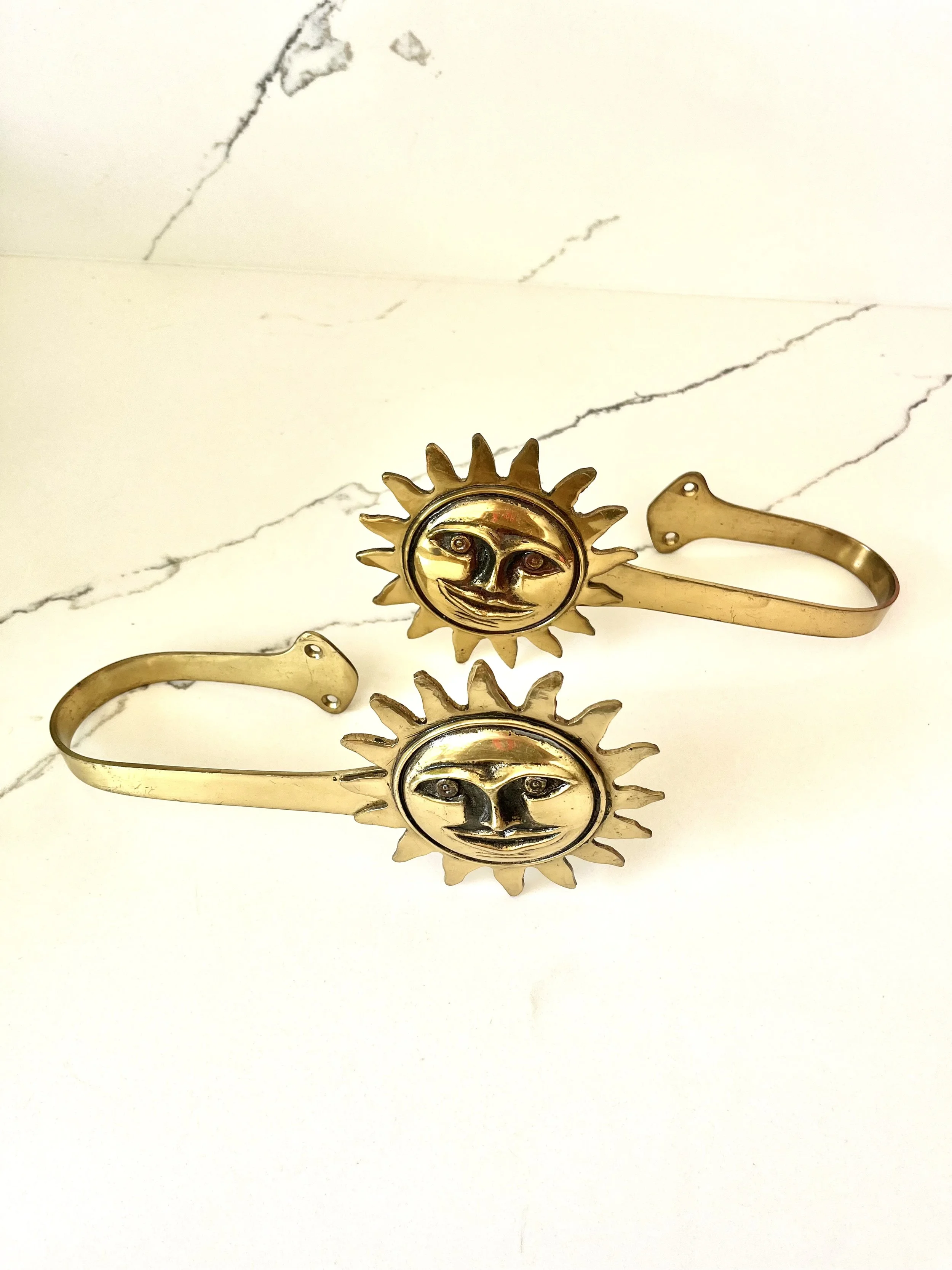 Pair of brass sun face curtain tie backs 3.jpeg