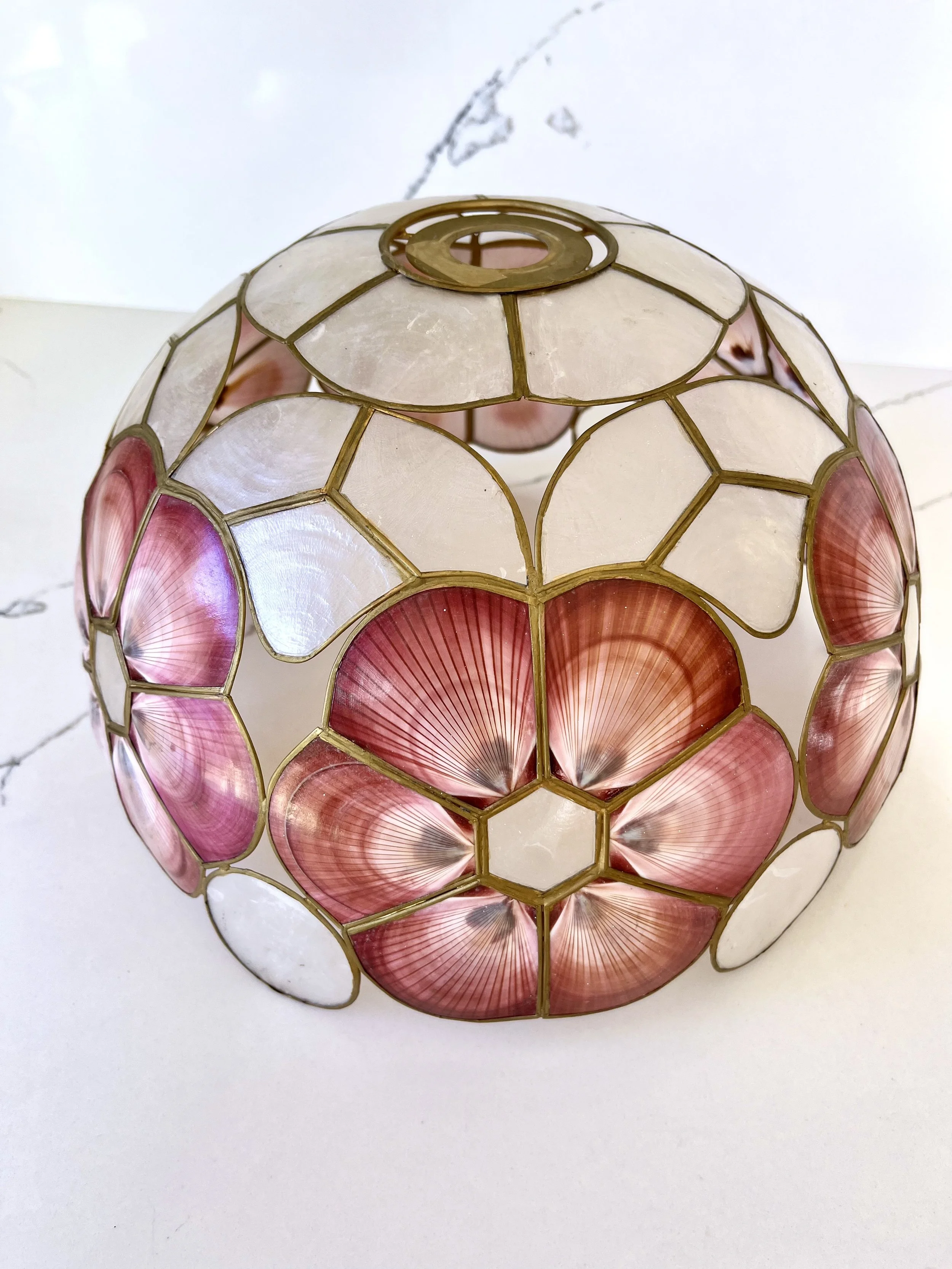 Decorative stained glass lamp with geometric patterns and floral motifs.