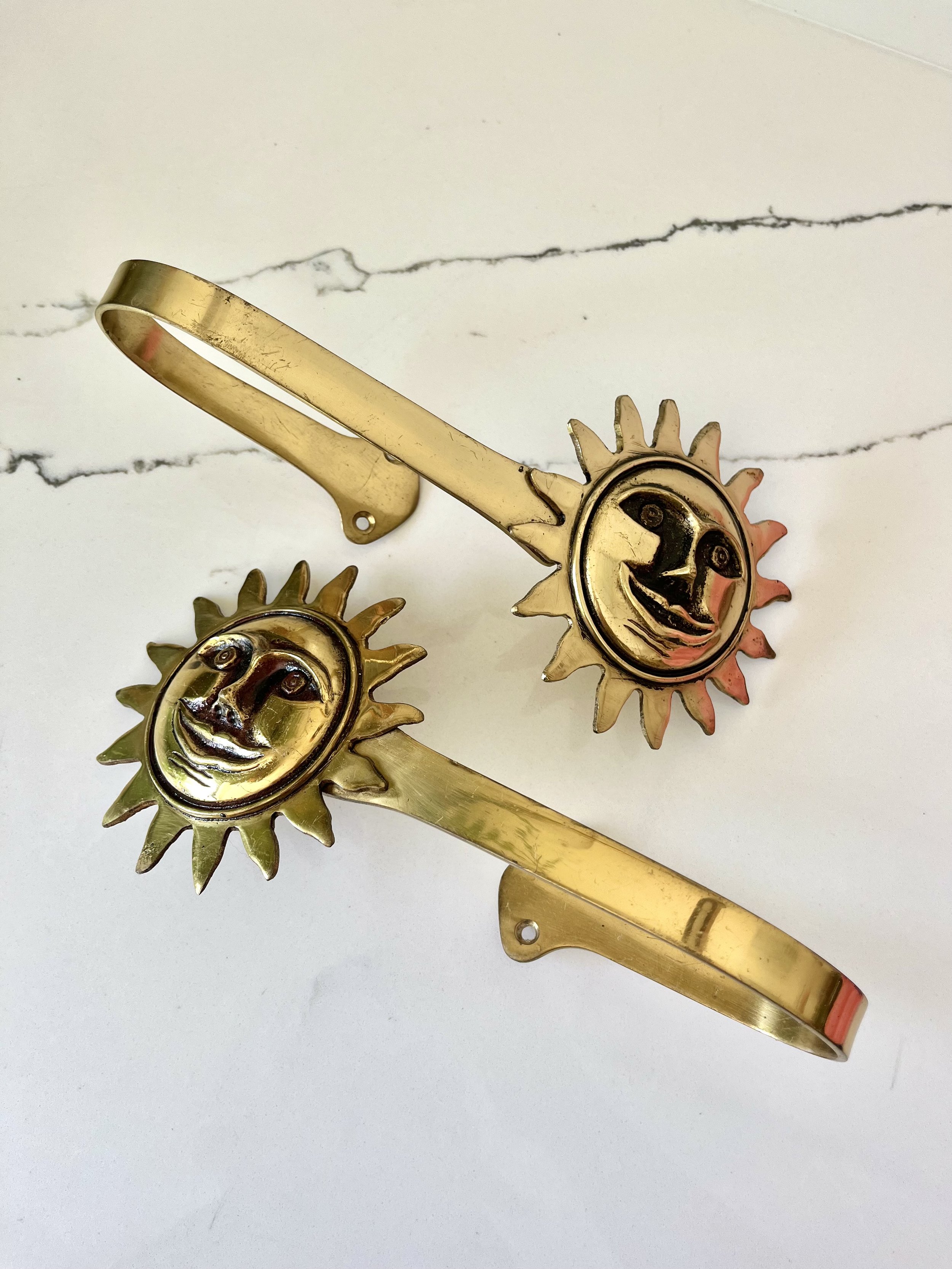 Pair of brass sun face curtain tie backs 8.jpeg