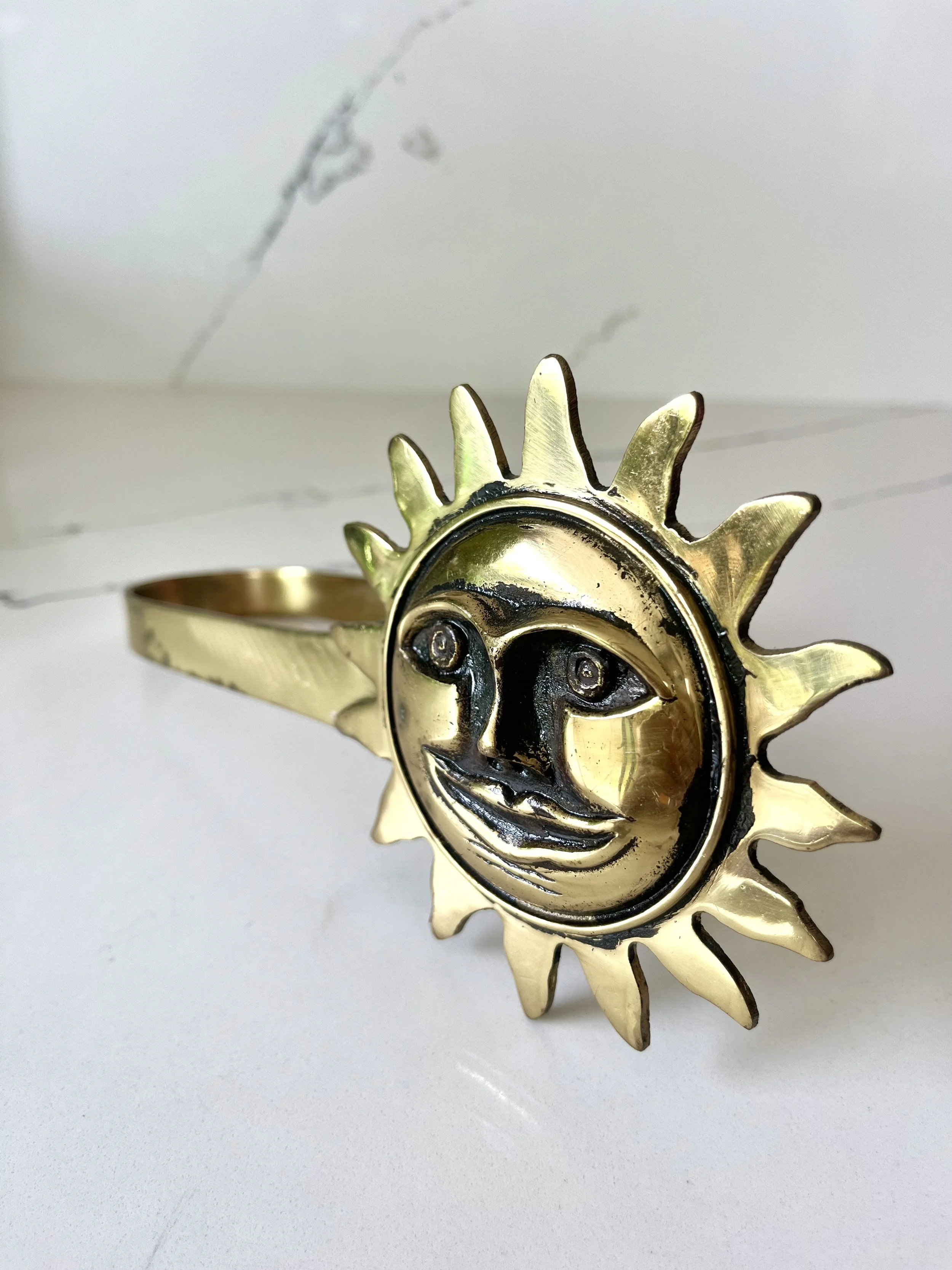 Pair of brass sun face curtain tie backs 11.jpeg