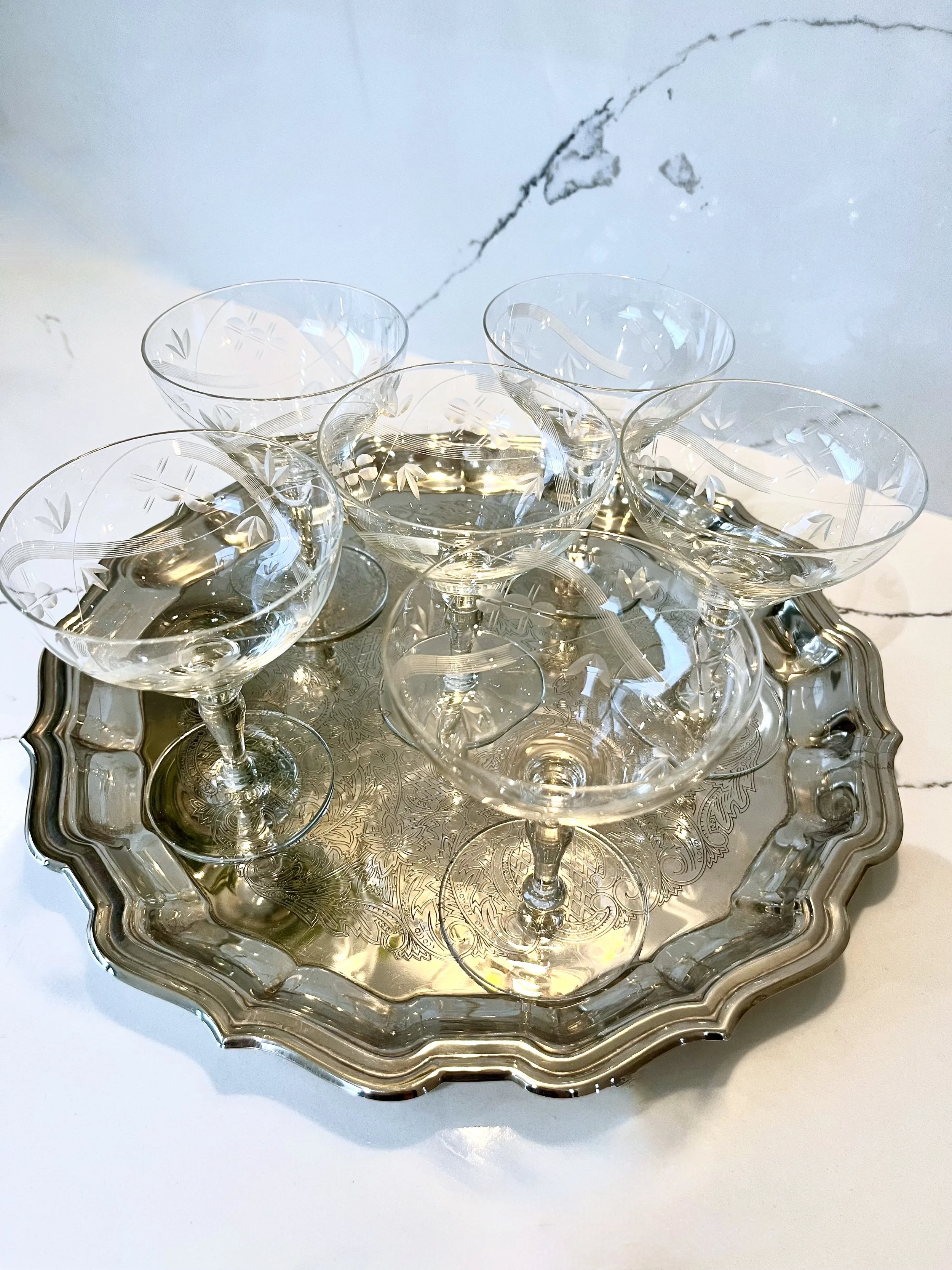 set of six glass coupes on a silver tray 3.jpeg