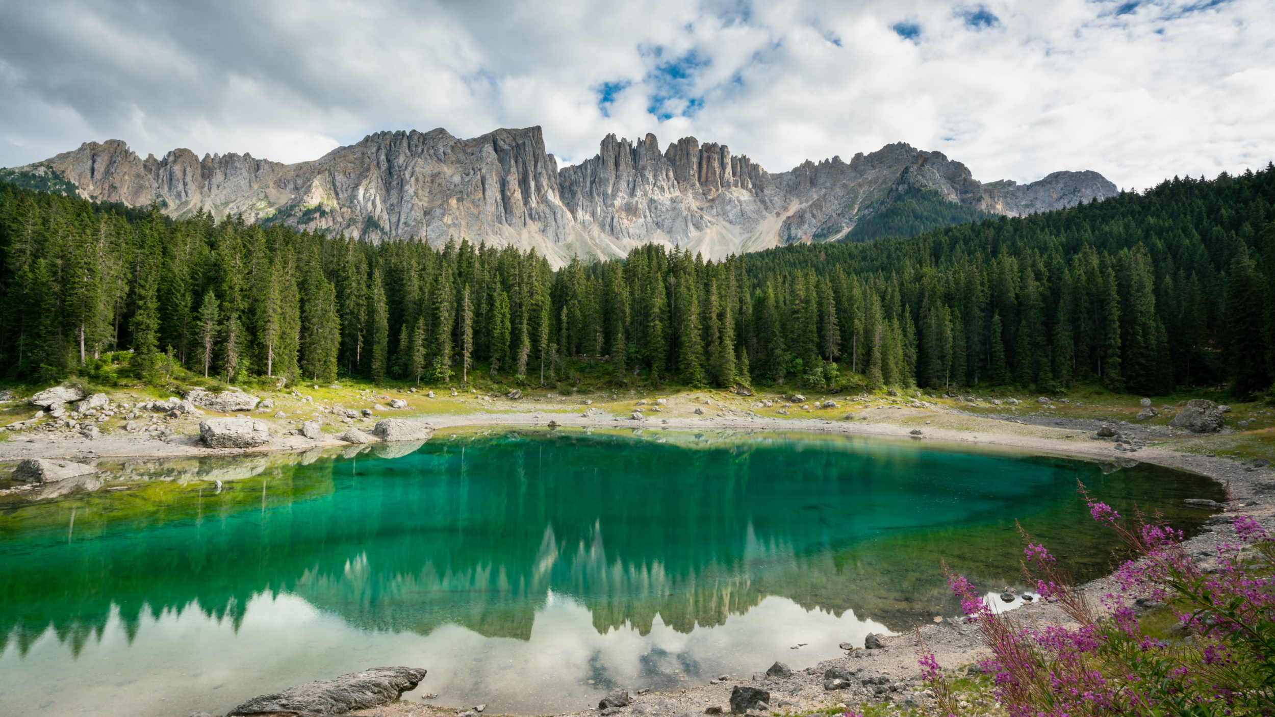 An emerald lake in the Dolomites, Italy