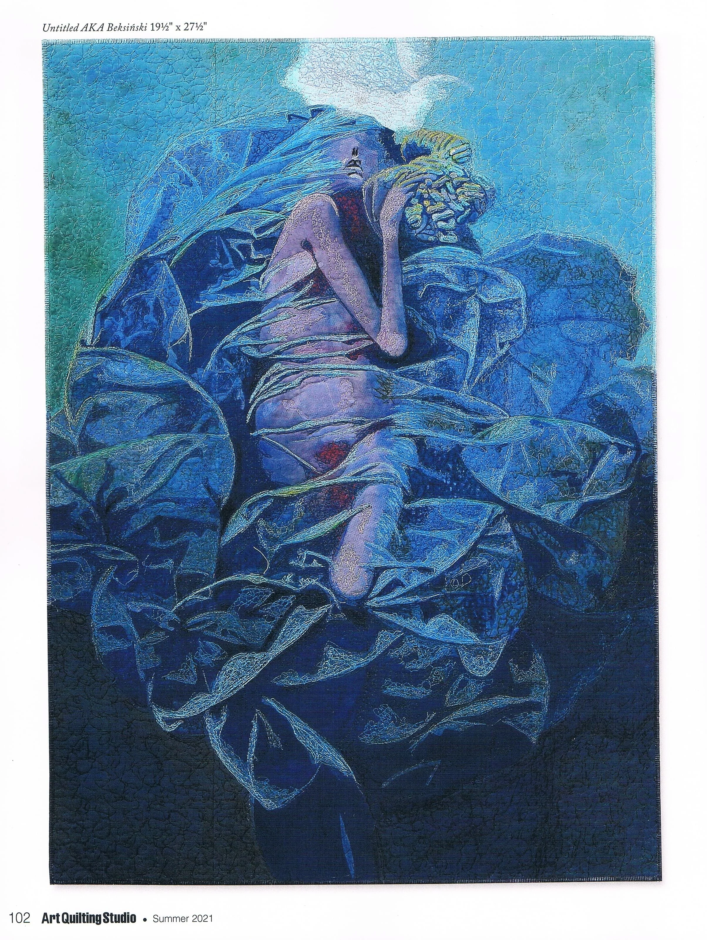 A quilted artwork depicting a person resting with a dog, rendered in various shades of blue and green on a patterned fabric.