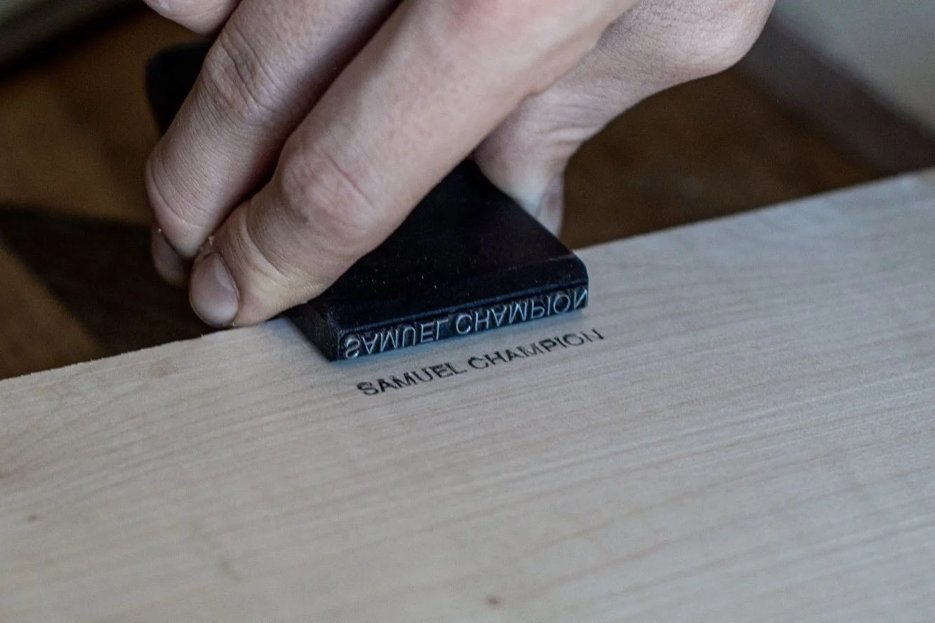 Custom made name stamp. You soot the end with a match or candle to blacken the depression. #samuelchampionfurniture #woodworking #furnituremaking #wood #stamp #sycamore
