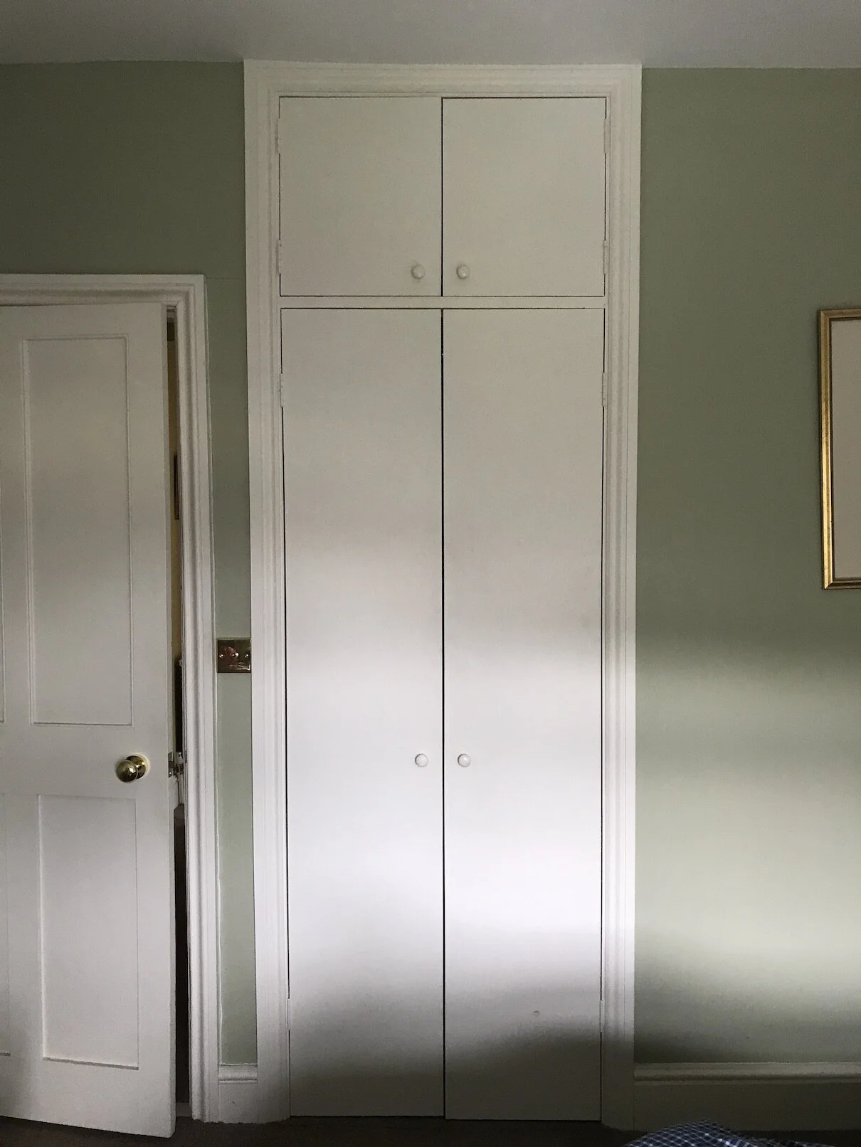 This Victorian house was very short on storage, especially in this little back bedroom.  We took out the old chimney breast and fitted in a really spacious cupboard with storage at the top for suitcases.