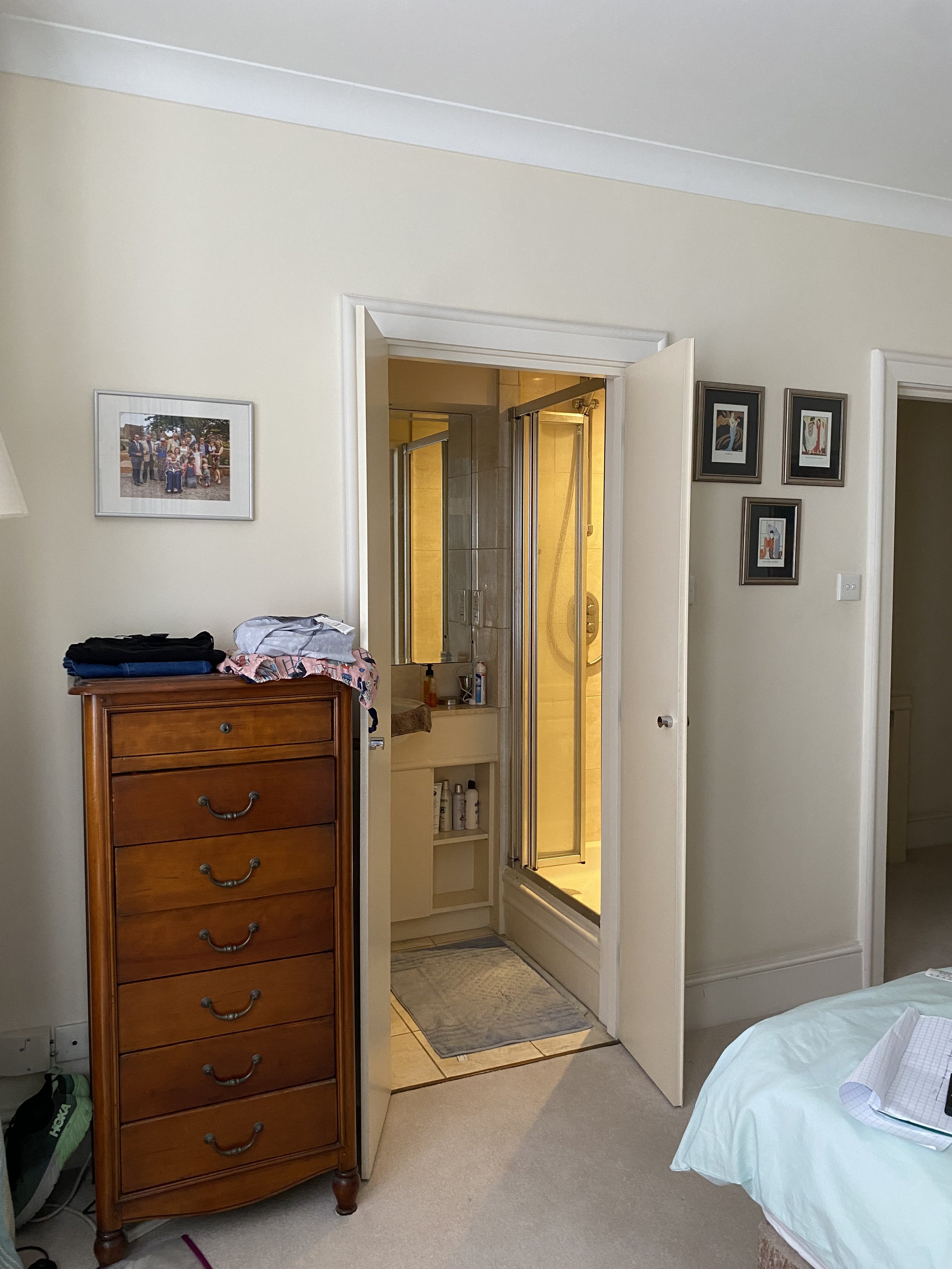 The tiny shower room was built off a basement bedroom