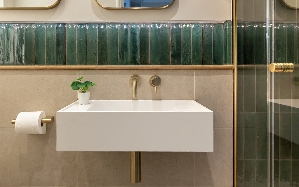 Every detail was thought through - the shelf is one tile high - enough for an electric toothbrush, and the basin has space to put soap on one side.