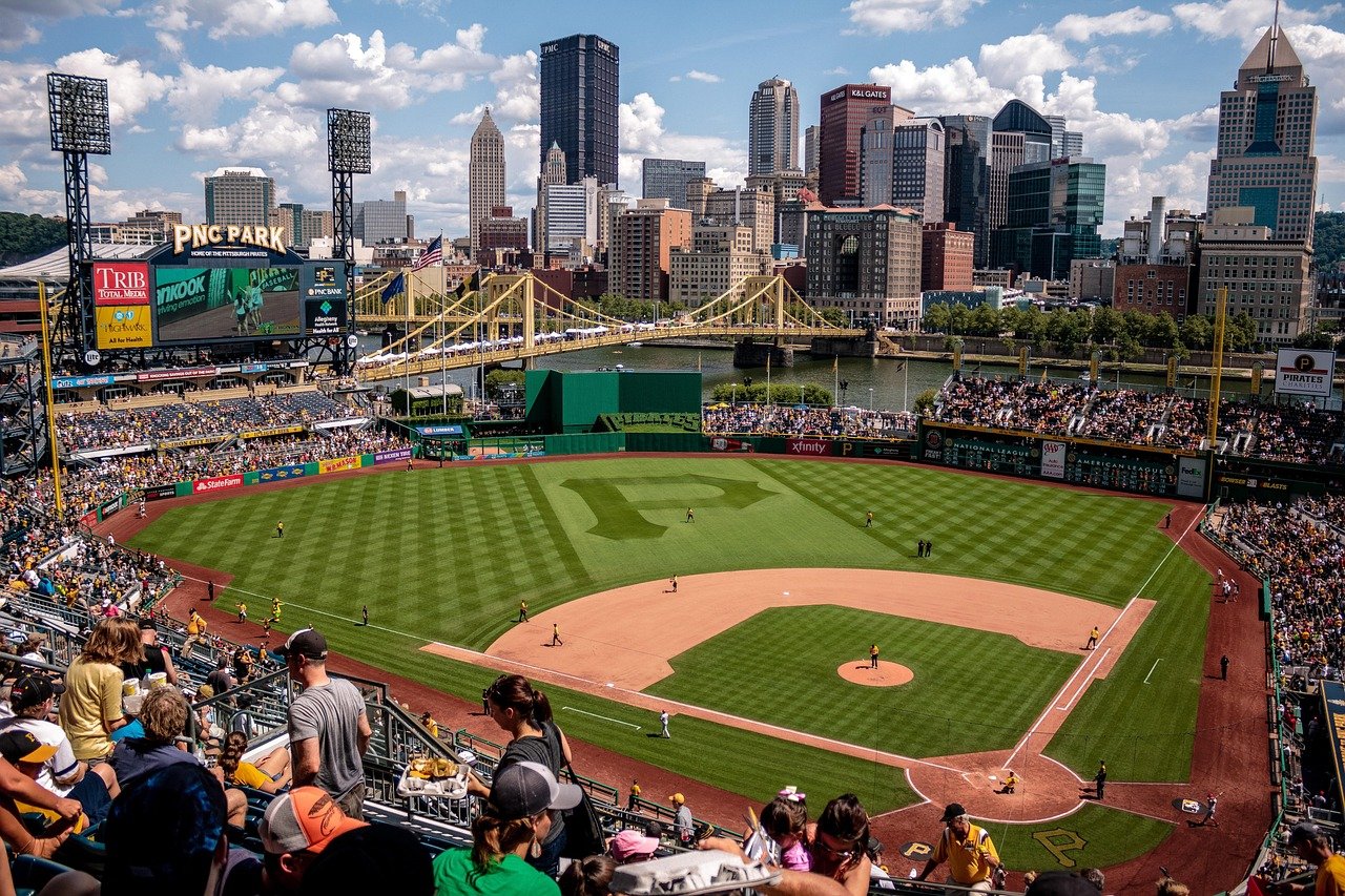 Baseball stadium of the Pittsburgh Pirates (PNC Park) with the Pittsburgh skyline in the background on a sunny day.