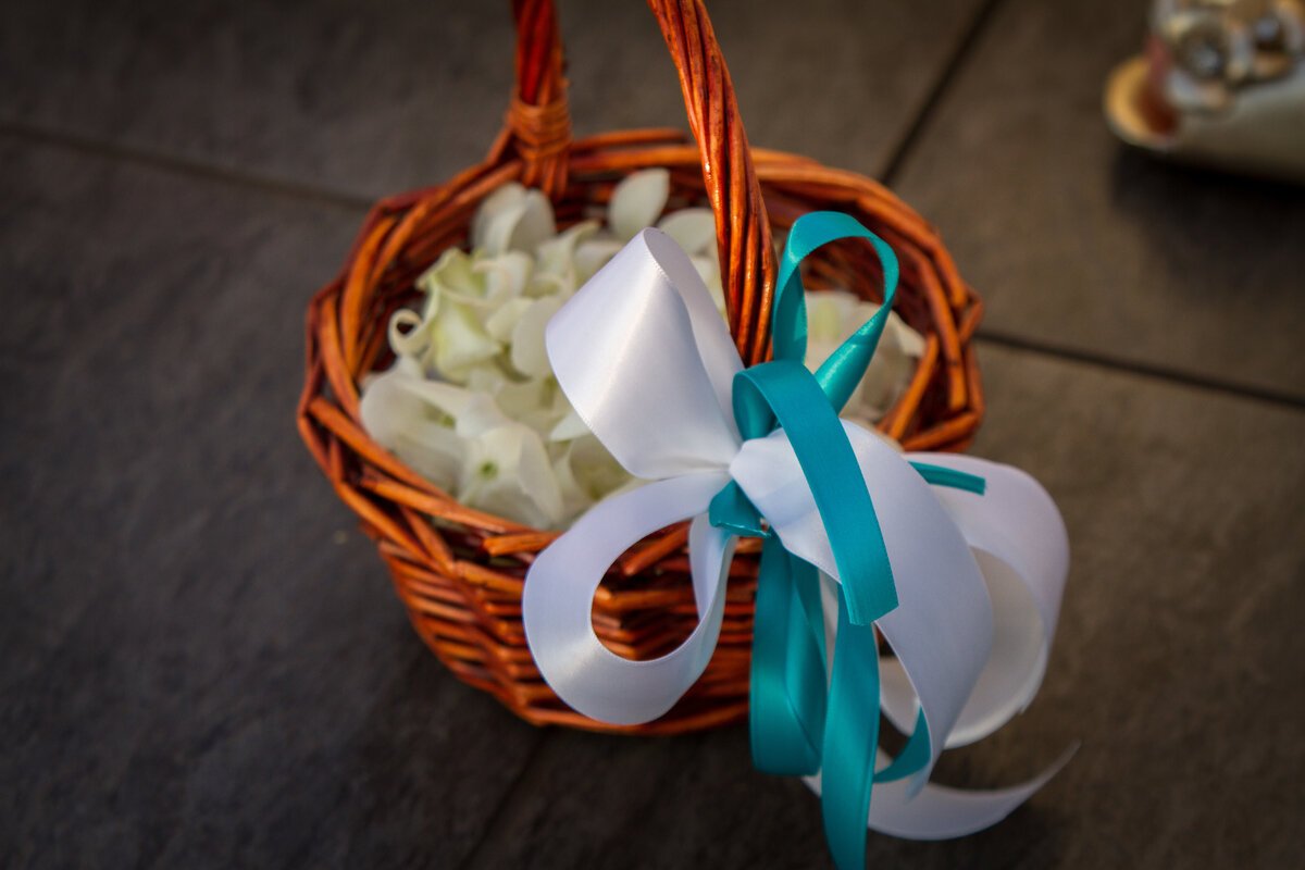 wedding-petals-basket-with-bow-blue-and-white-bow-white-petals.jpg