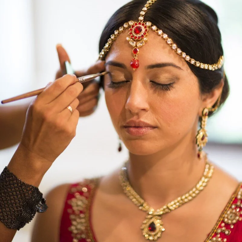indian-bride-ruby-headpiece-bride-getting-make-up-headpiece-jewelry.jpg