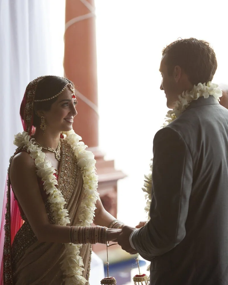 indian-wedding-bride-and-groom-wedding-vows-groom-with-lei.jpg