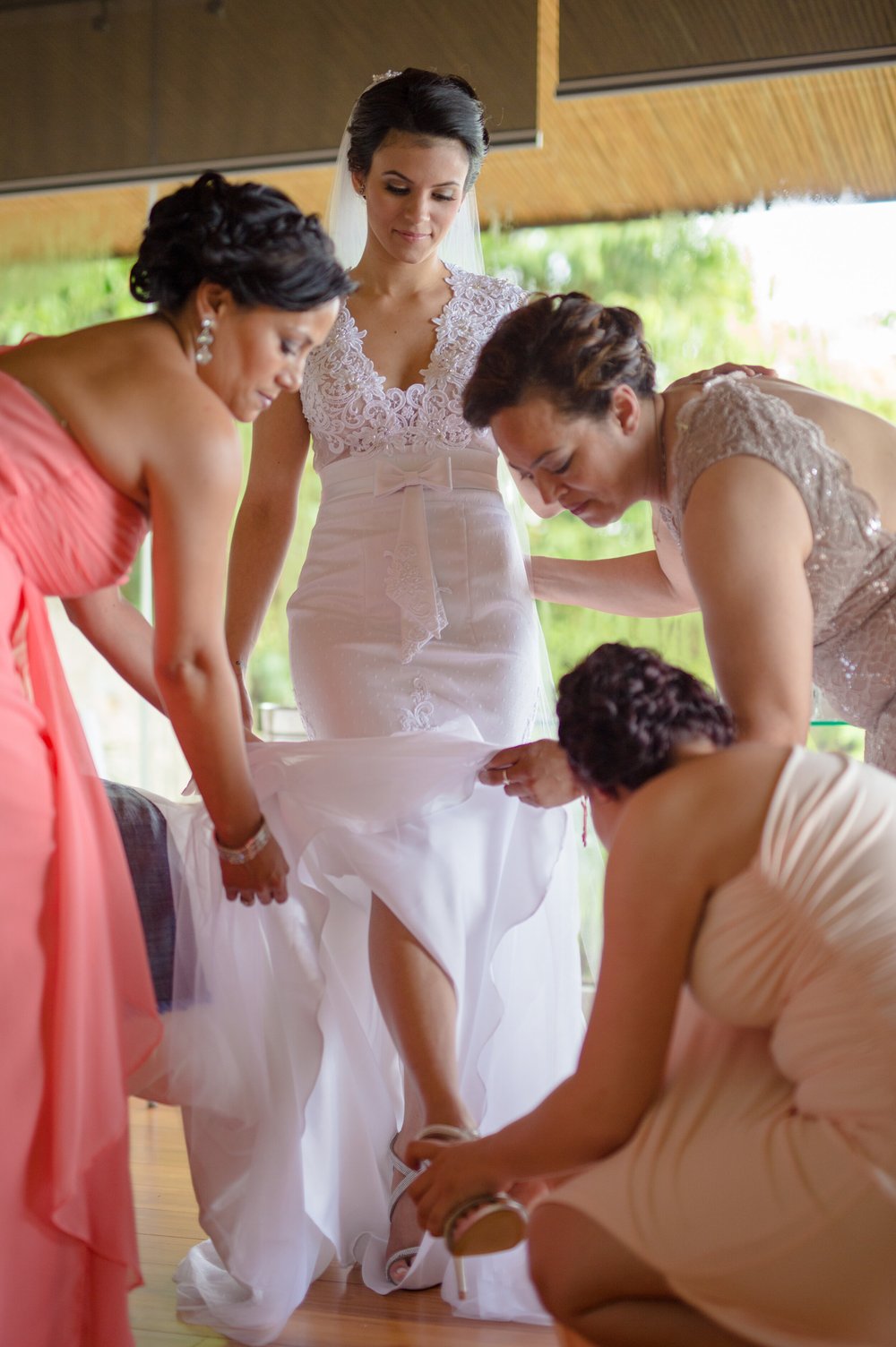 bride-putting-on-shoes-bride-and-bridesmaids.jpg
