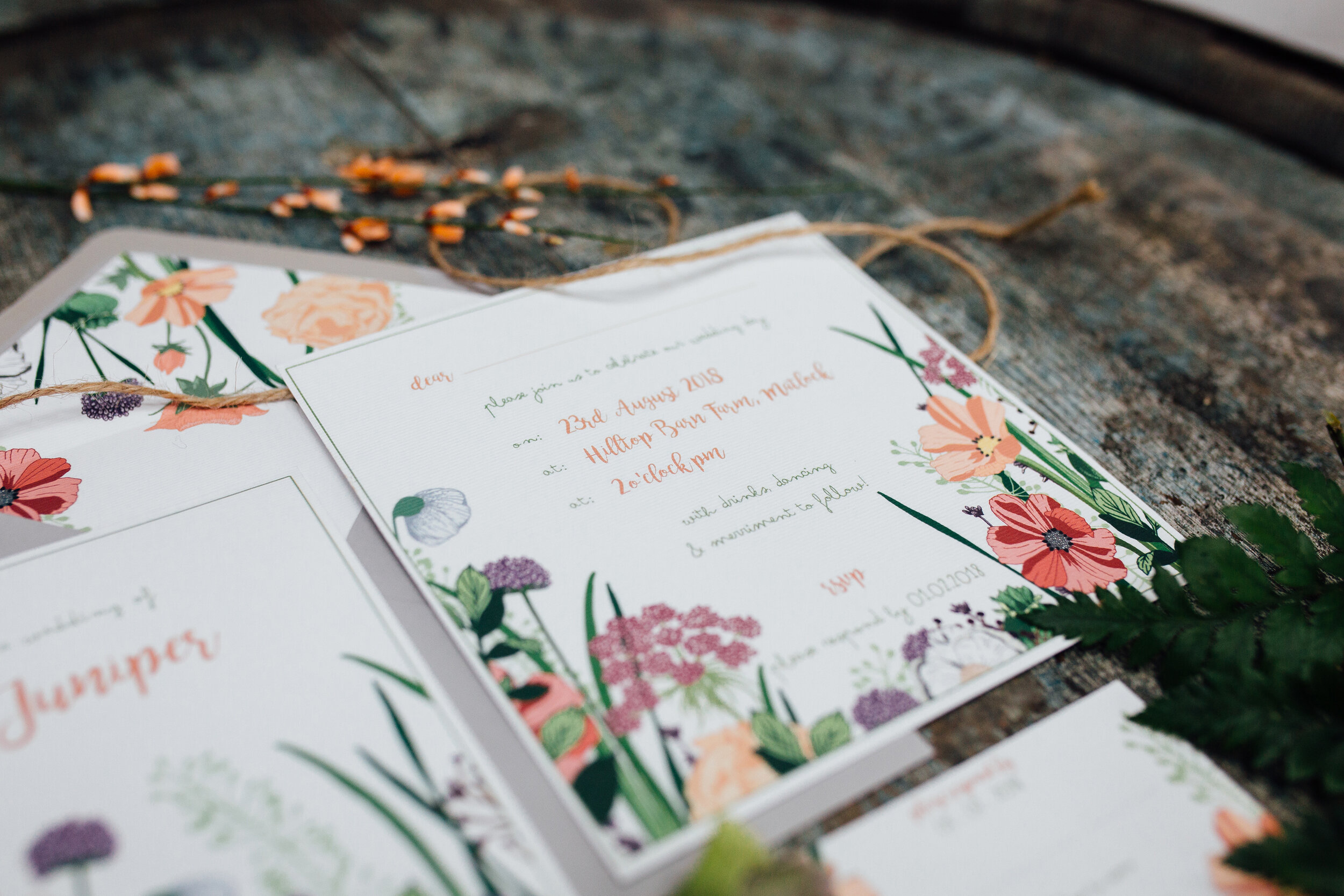 Simplistic, understated, luxury wedding invitations, with peach & coral wild flowers, perfect for a Spring or Summer Wedding. Ready to order from the Wildwood Paper customisable stationery ranges. Photographed by Ellie Grace Photography.