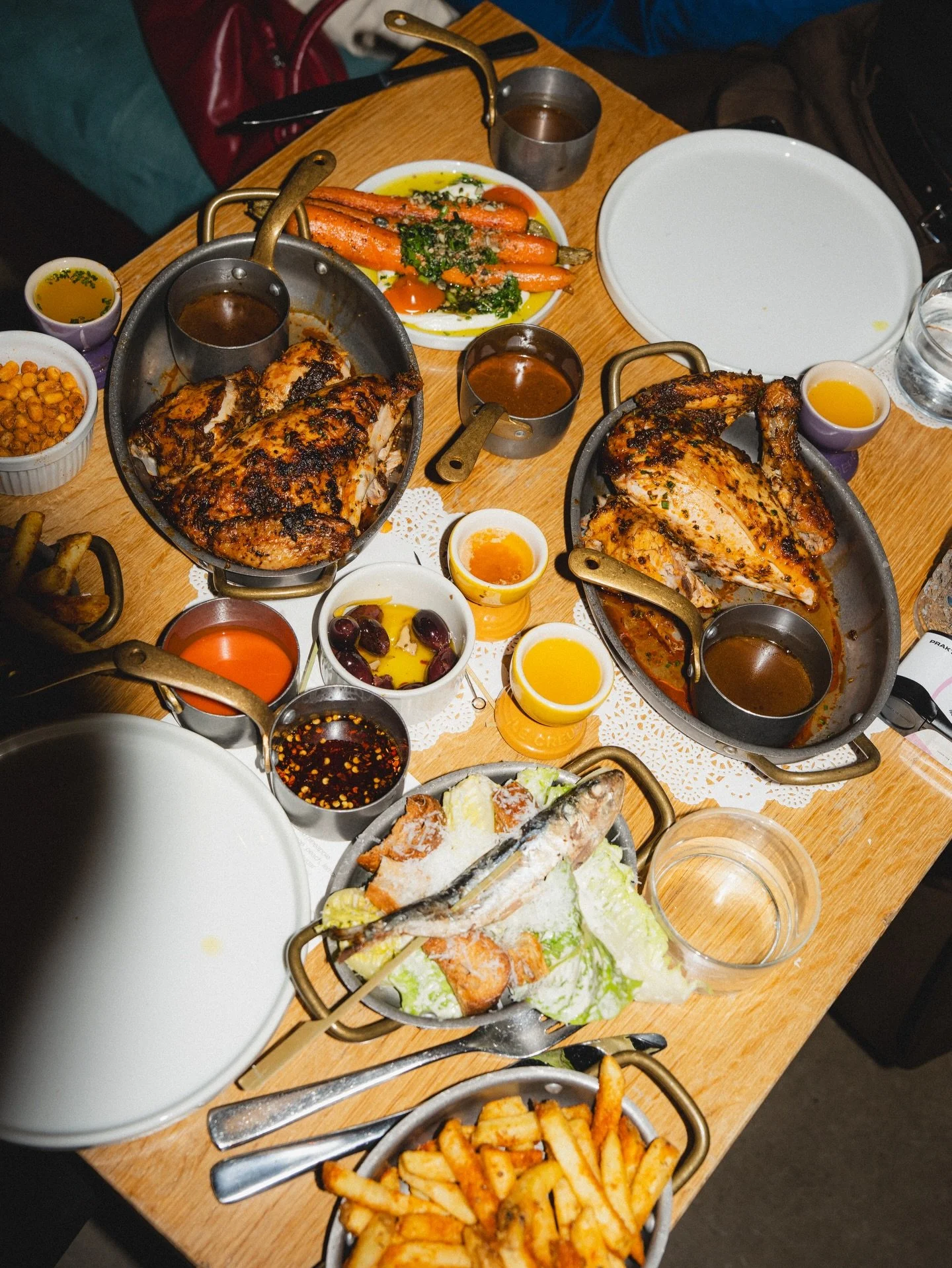 Vibes Of Le Coq. Unmatched. rubbed + roasted succulent chicken, all the smothers, martinis, big juicy Beaujolais, crisp whites, sides on sides, French beats.

we do our thing Wednesday to Saturday. Groups of any size and for any celebration.

Grab th