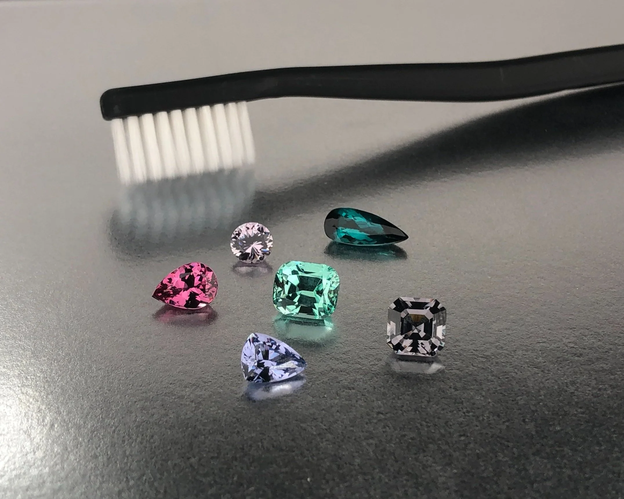 How to clean fine jewelry safely using a soft toothbrush and natural gemstone jewelry.
