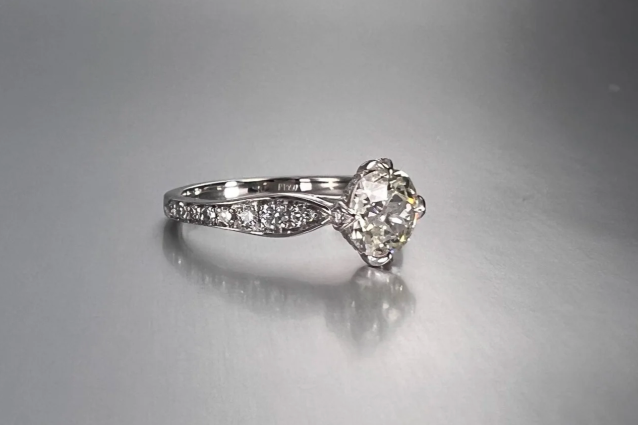 Front view of a custom platinum engagement ring featuring a 1.39 ct Old European cut natural diamond with pavé single-cut natural diamond accents.