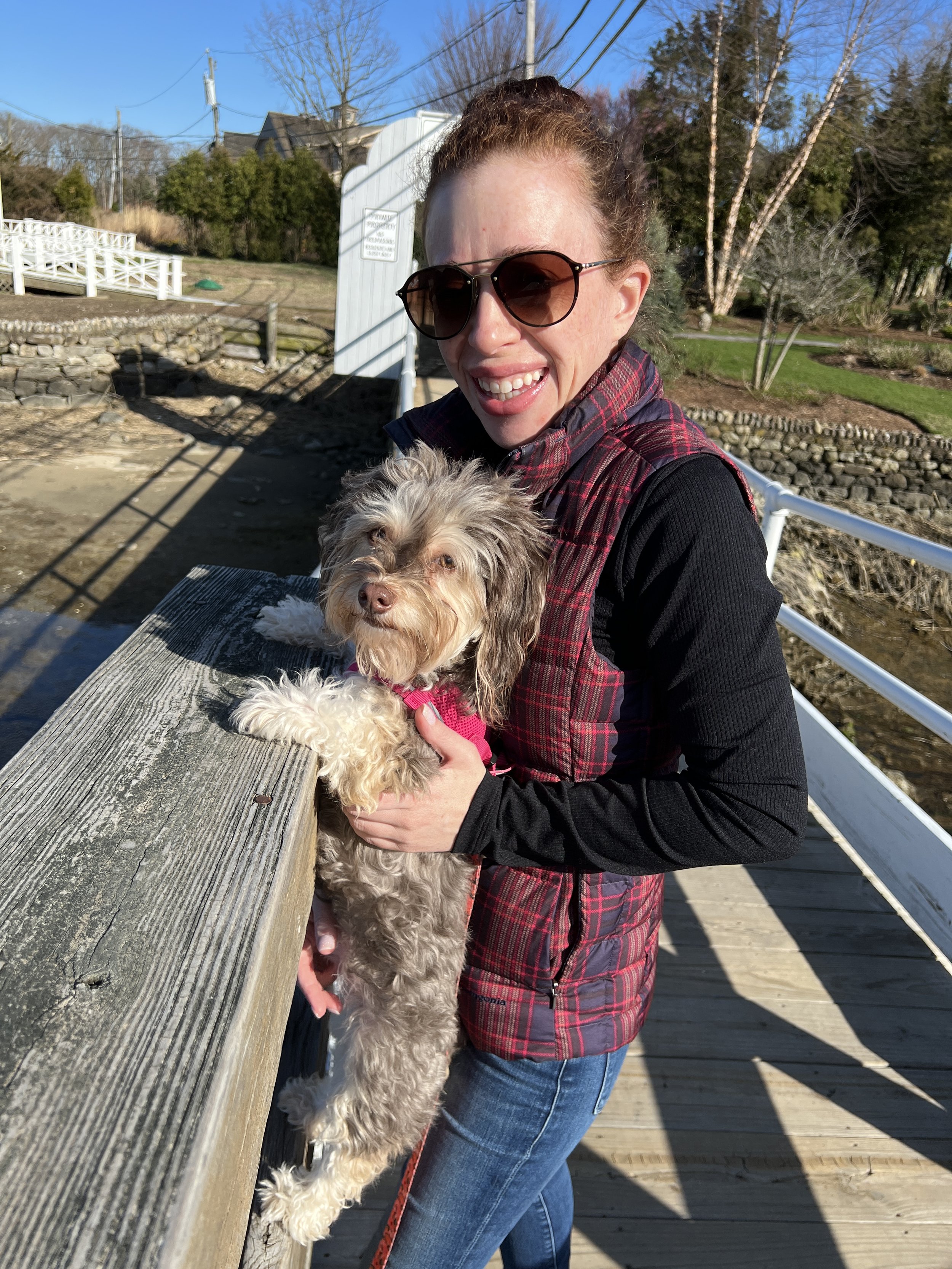 Erica Silverglide enjoying time outdoors with her dog.