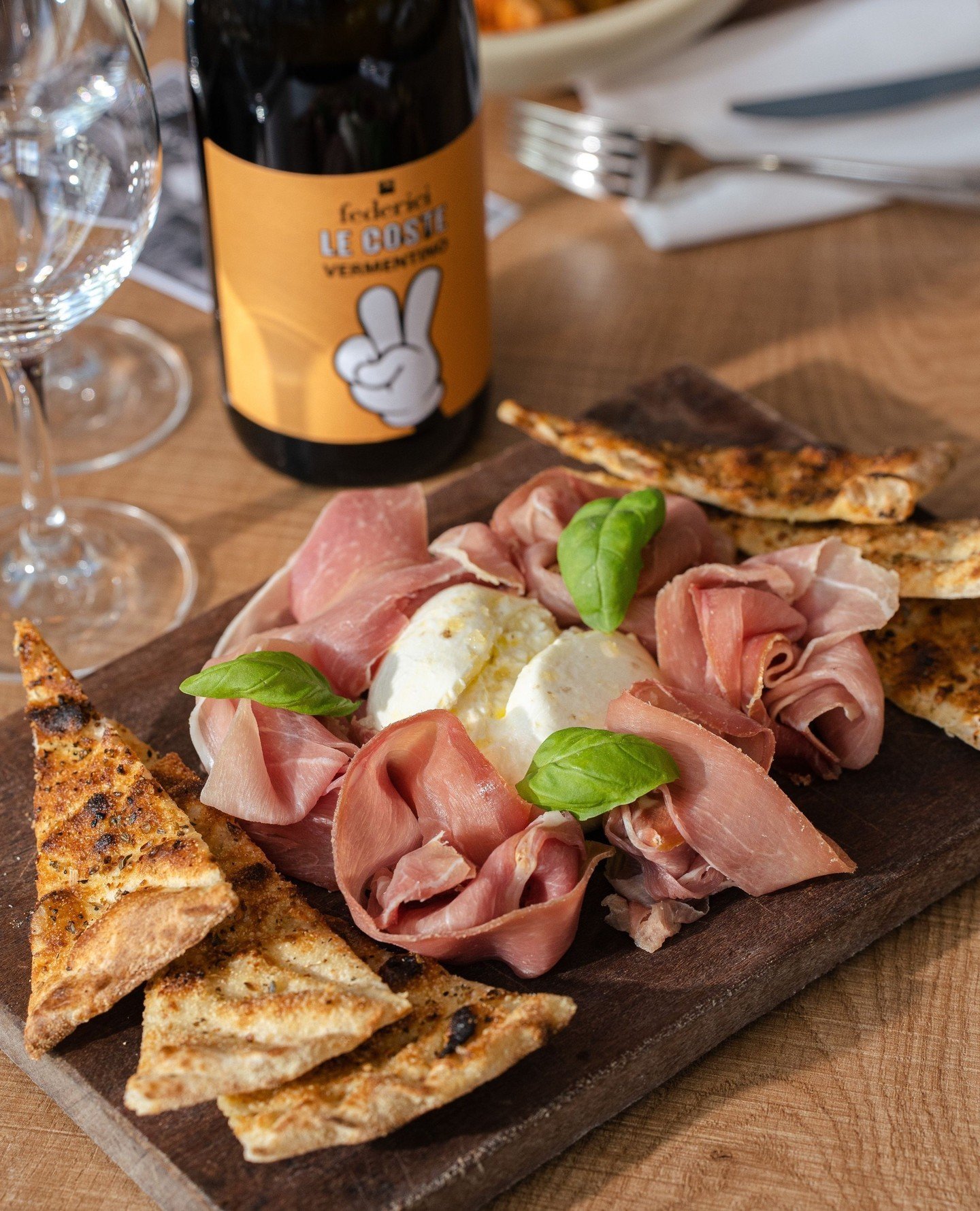 Burrata, prosciutto, and a bottle of wine is the perfect recipe to the start of a great night.⁠
⁠
When bottles are 50% off on Tuesdays and Wednesdays there's only one right thing to do. ⁠
⁠
Enjoy it with our weekly special and with a special person i