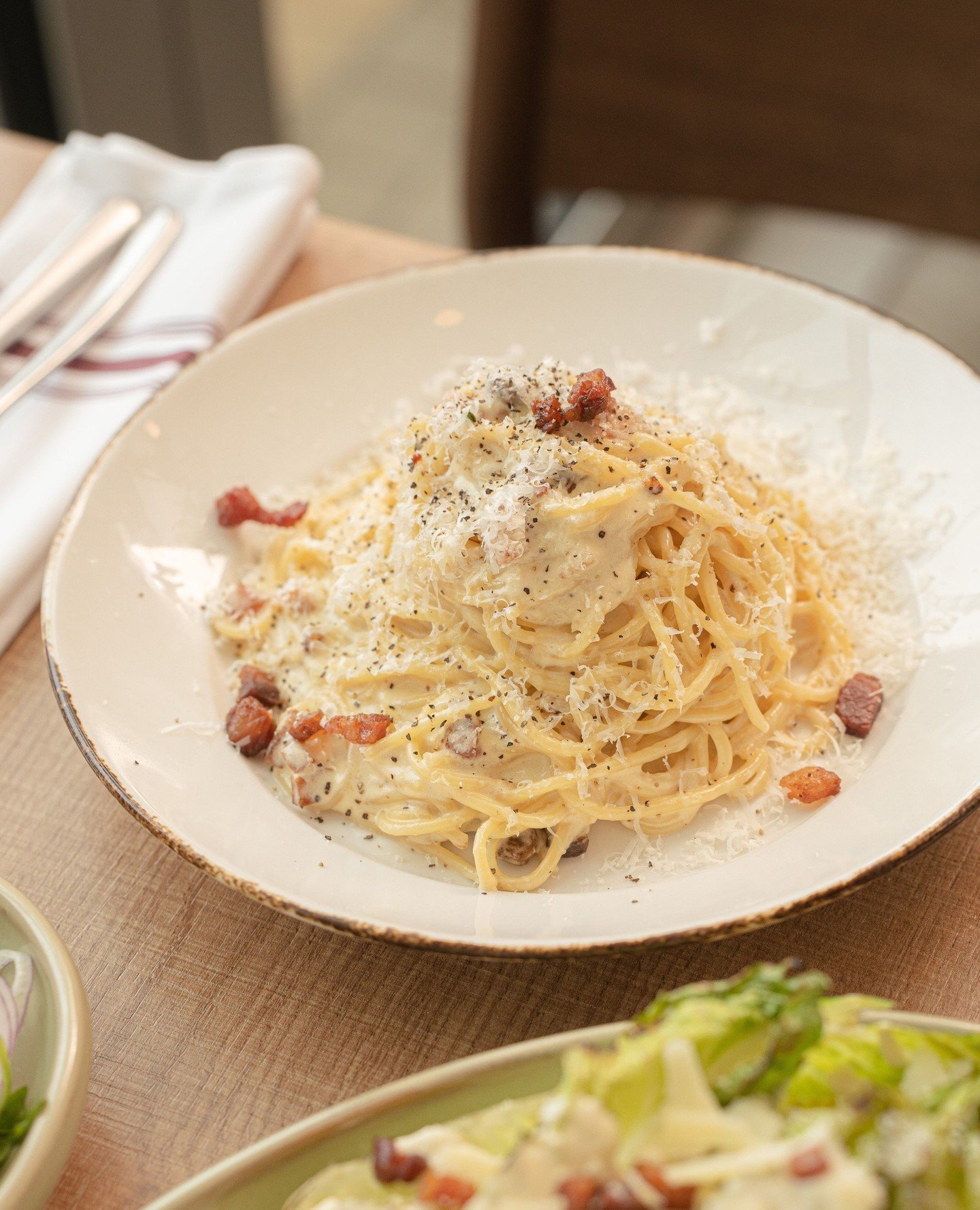 A classic and a favourite for a reason.⁠
⁠
The Carbonara, is a staple in our restaurant. This creamy pasta paired with crunchy guanciale makes for a very satisfying dinner. ⁠
⁠
Always welcoming egg, guanciale, onion, cream sauce, and grana padano int