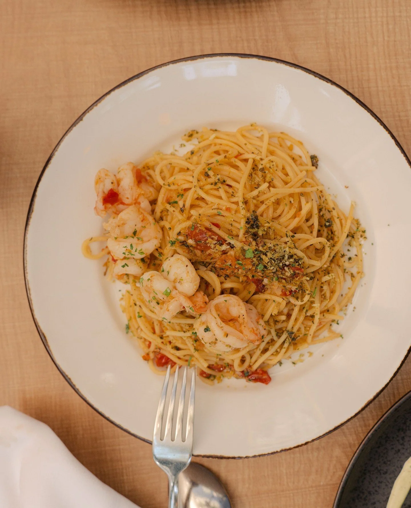 Don't we all love a big bowl of pasta?⁠
⁠
The Spaghetti Aglio e Olio is new to our menu, featuring garlic, calabrian chili, parsley, lemon zest, blistered cherry tomatoes, and pane grattato.⁠
⁠
With the addition of prawns, you'll be transported to th
