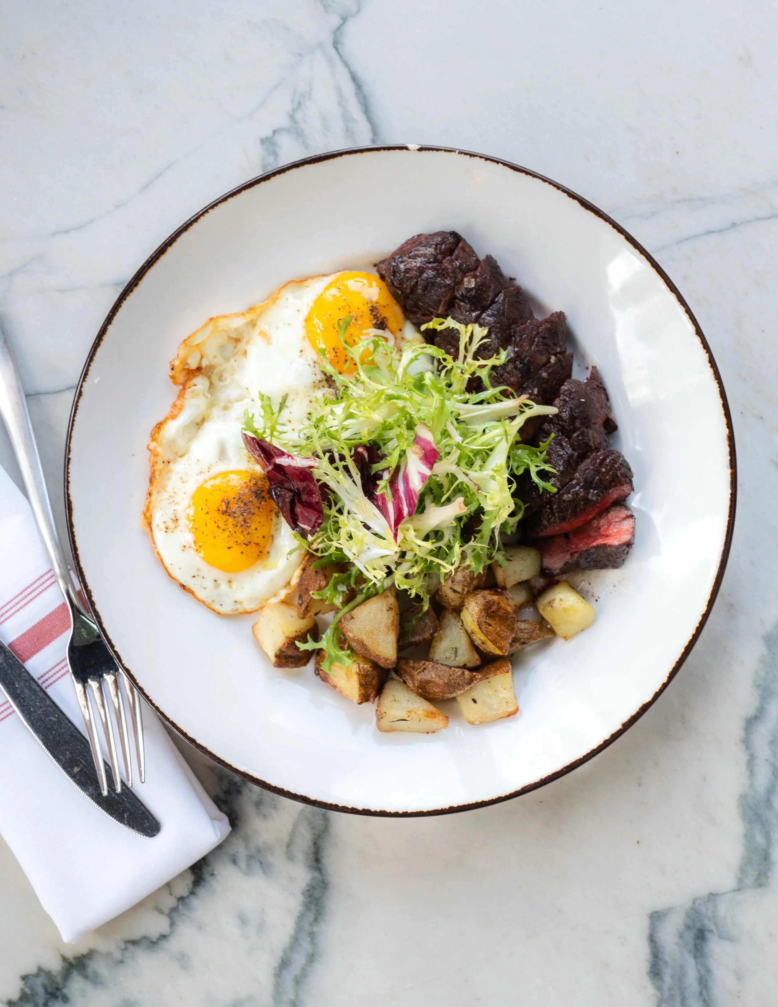 Our Steak &amp; Eggs comes with a 6oz grilled hanger steak, crispy rosemary potatoes, farm eggs, and parmesan. A brunch plate done right.

Perfect for a Father&rsquo;s Day treat too. Because some things just hit better when shared at the table 🥂

Bo