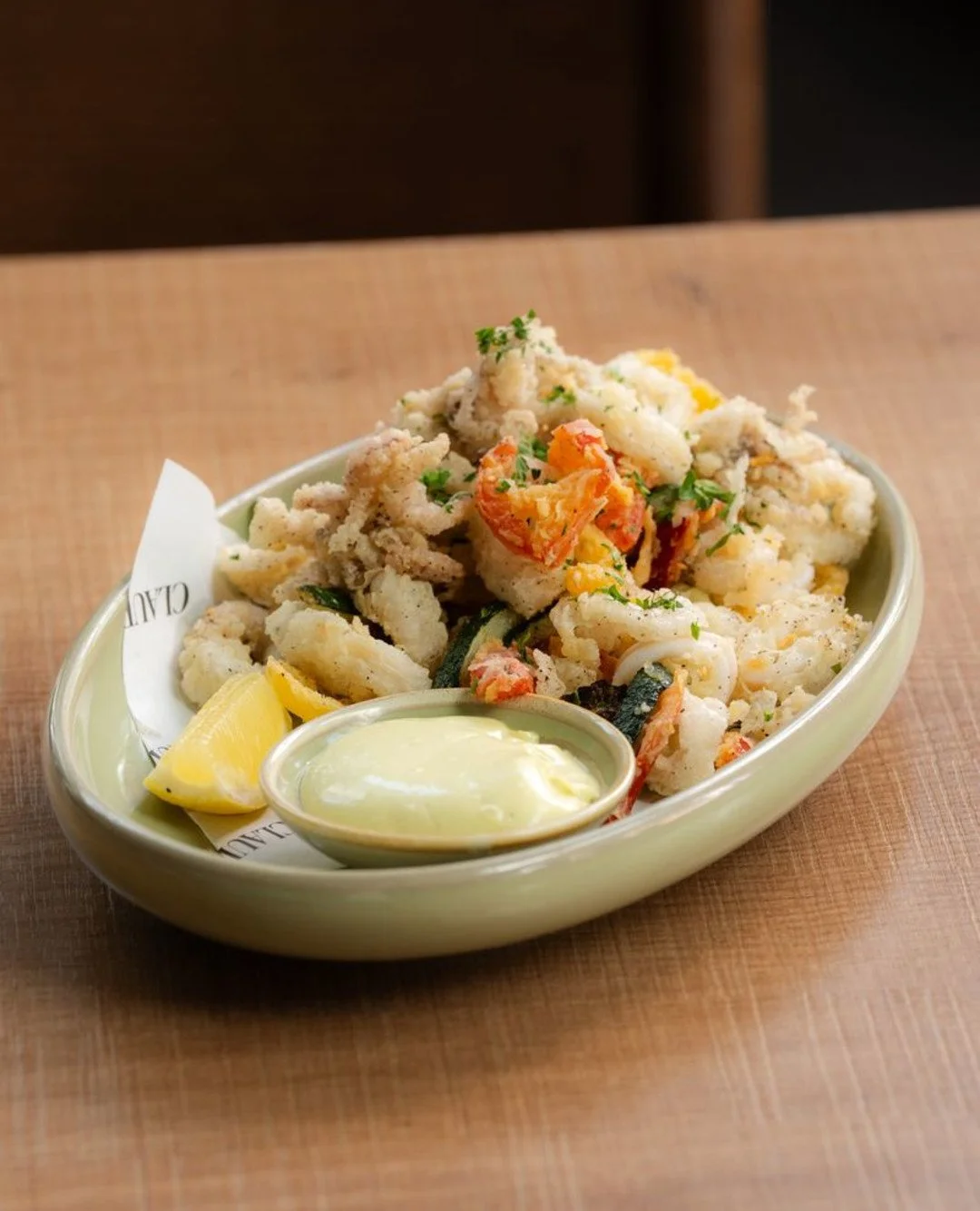 The Italian coast called&hellip; it wants its calamari back. 

Crispy calamari served with peperoncini, zucchini, lemon, and basil aioli.