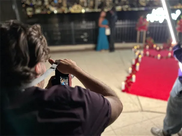 NYC proposal photographer WPR Creative capturing a romantic night engagement on a candlelit red carpet