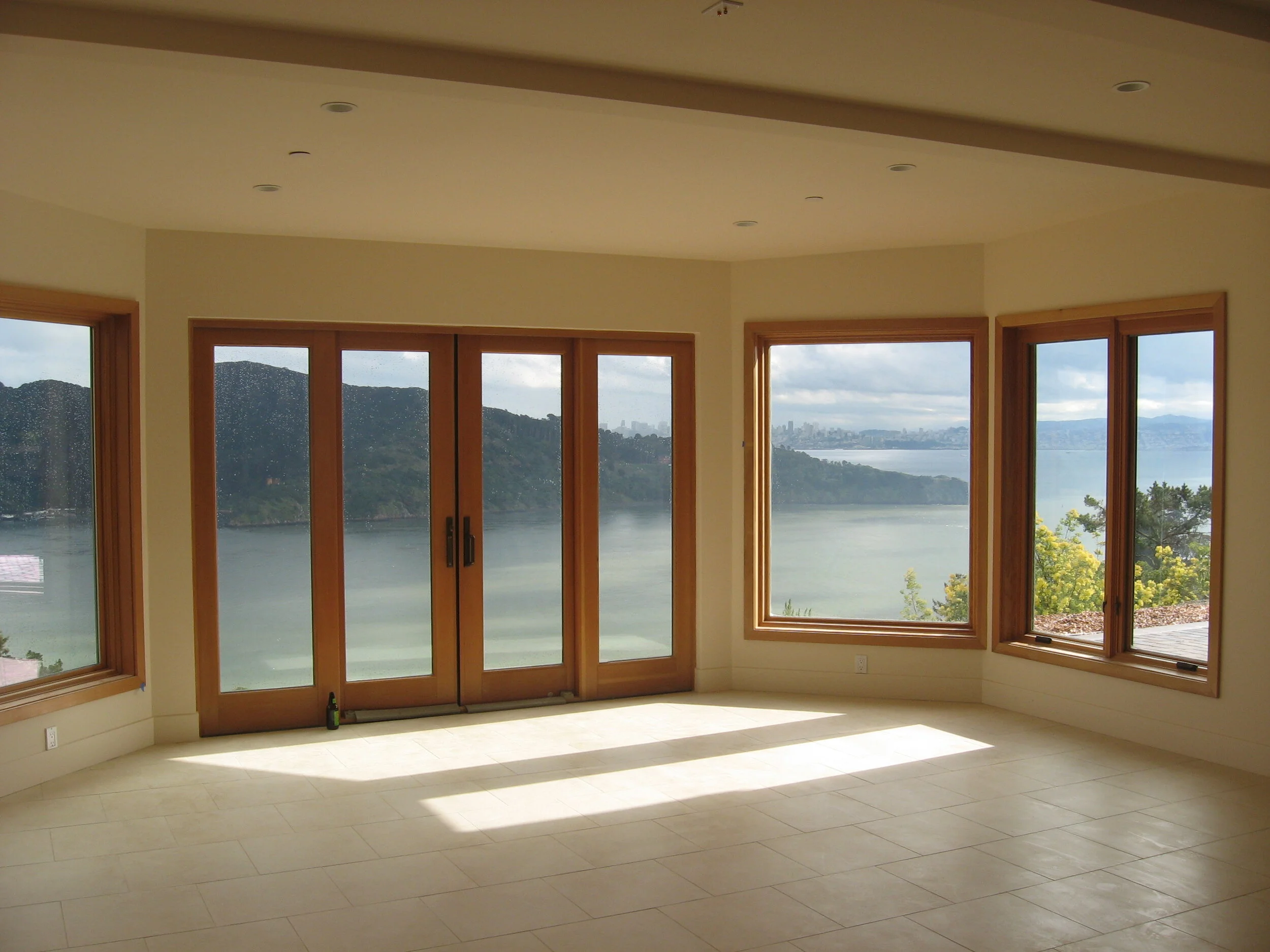 Interior room with natural wood window frames