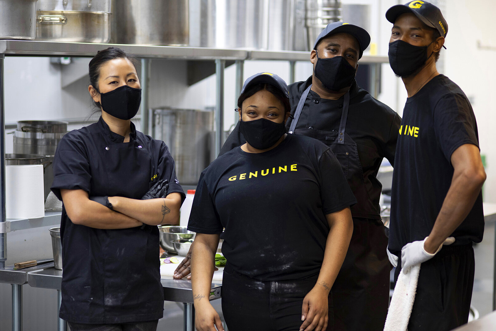 Genuine Foods team smiling in kitchen