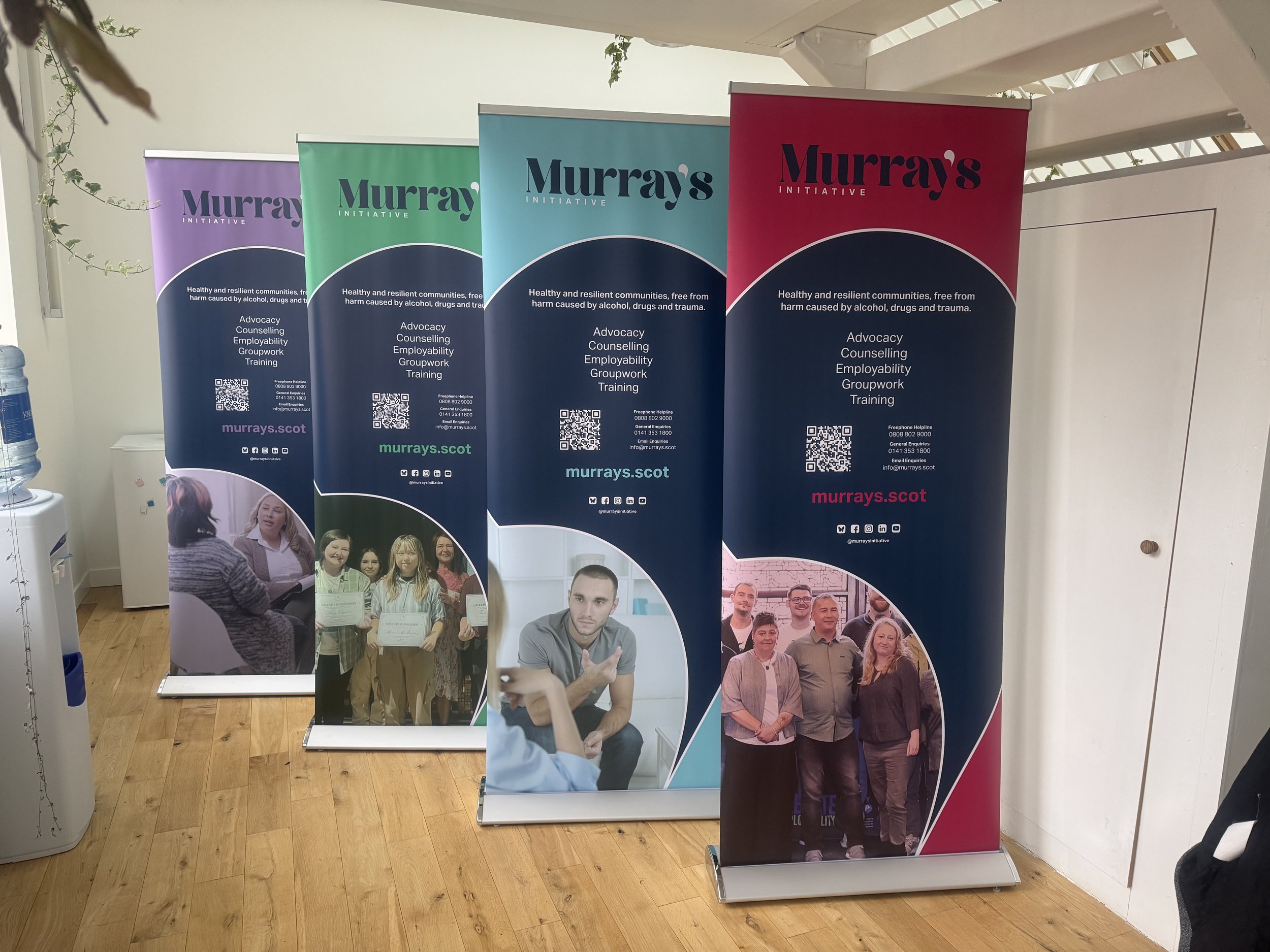 Photo showing four Murray's Initiative pop-up banners