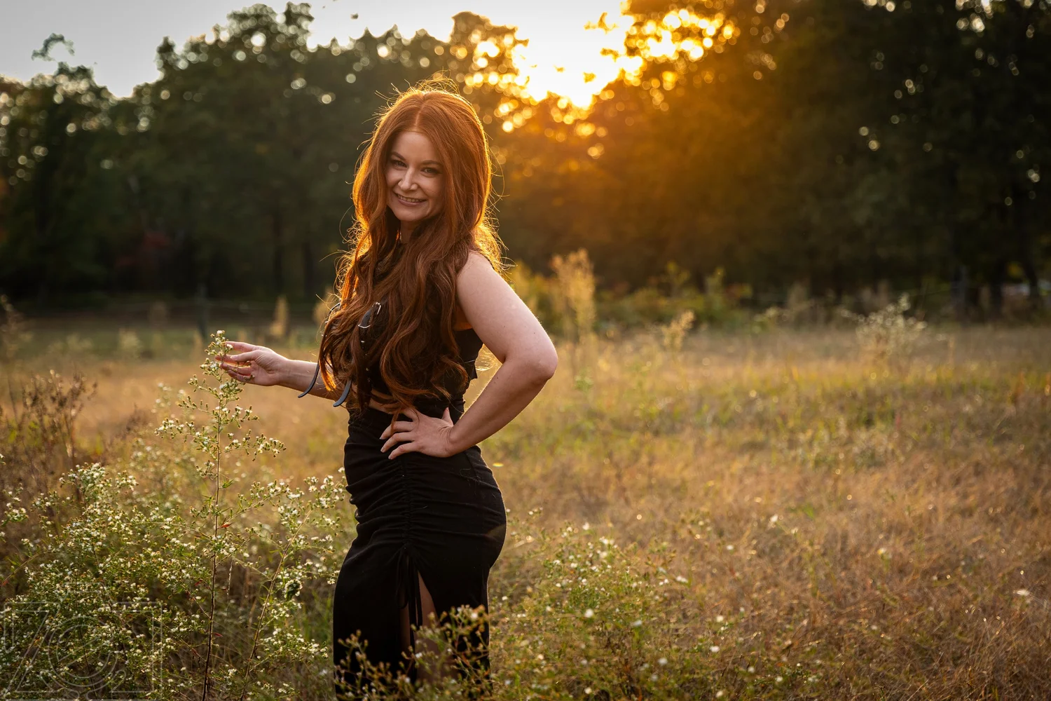 Portrait in a sunlit field at golden hour