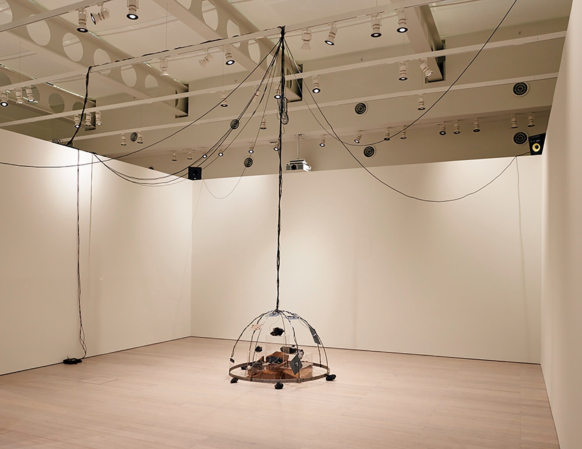  Yixuan Shao and Bicheng Liang  Left Without The Means To Move , 2021 Lava rocks, anodized aluminum, bone conductors, pit fired wild clay and sound recorded within, desert soil, amplified microphones, speakers, subwoofers, and other mixed media 204" 