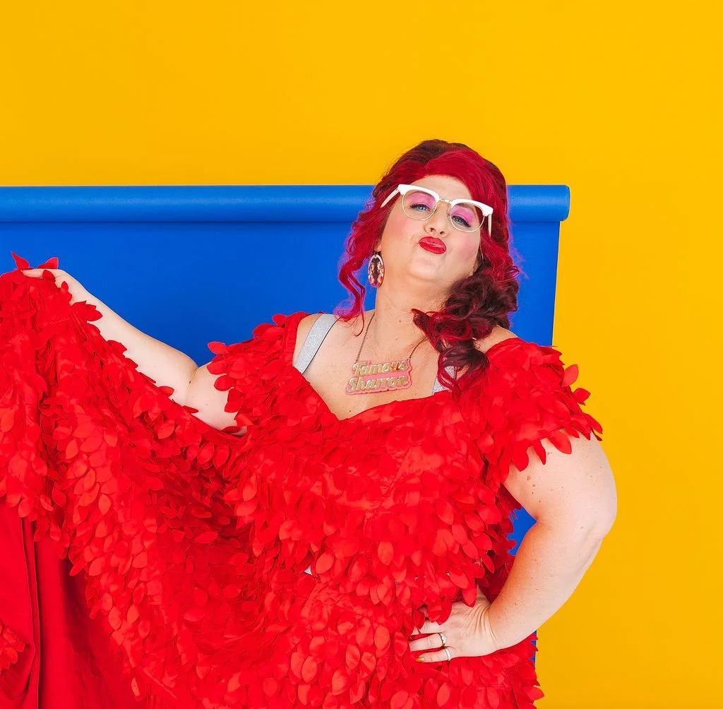 Famous Sharron_POSED Red Dress Blue Bk Kisses_WS.jpg