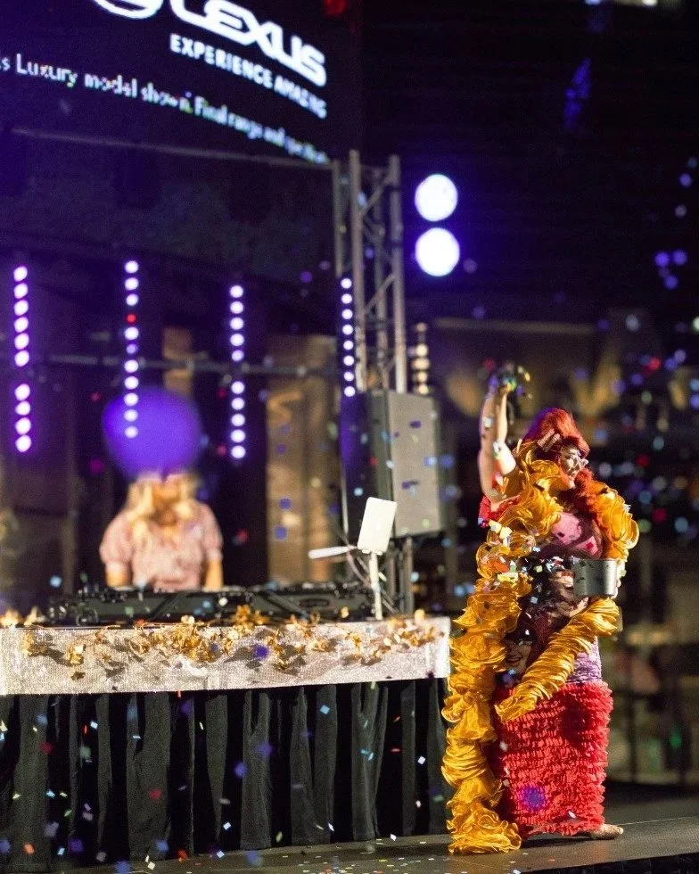 Famous Sharron stands on a large outdoor stage hosting for New Years Eve in City of Perth for Yagan Square.