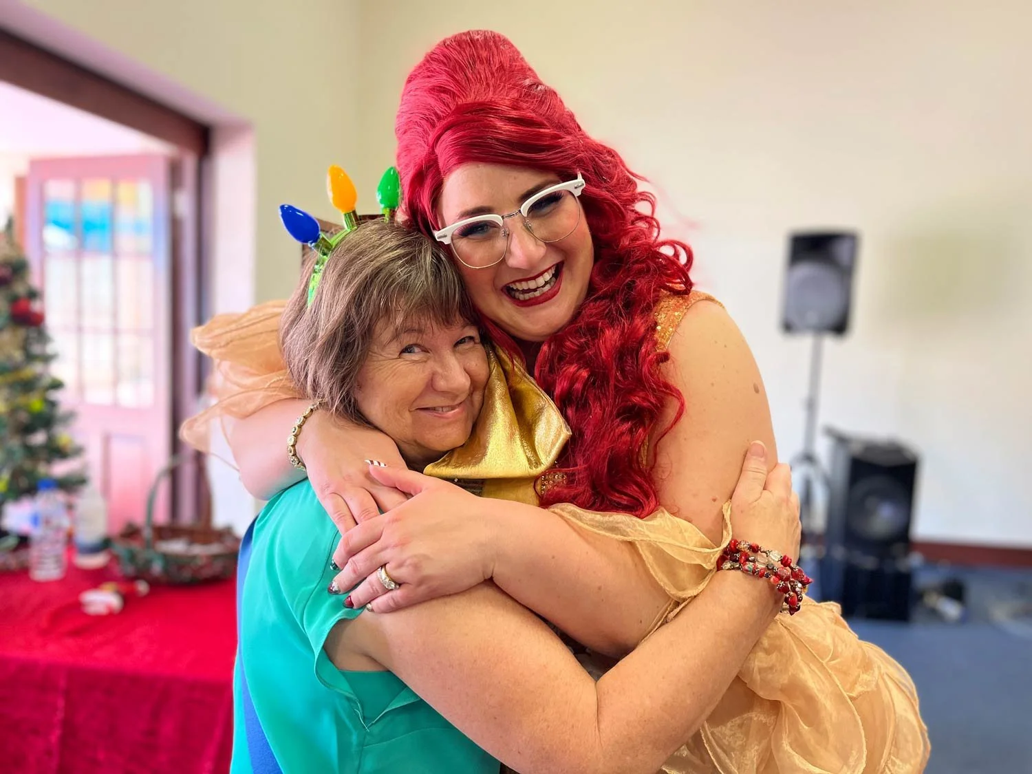Famous Sharron hugging a lady at the St Pats Christmas lunch charity event.