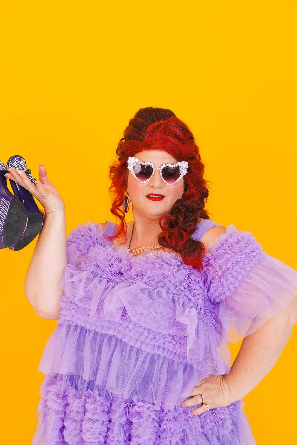 Famous Sharron_POSED_Purple Shoes in hand_WS.jpg