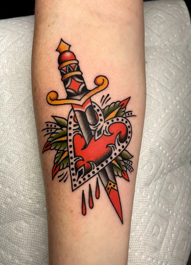American Traditional dagger through a heart tattoo by Nick at Electric Street Tattoo, Fort Lauderdale