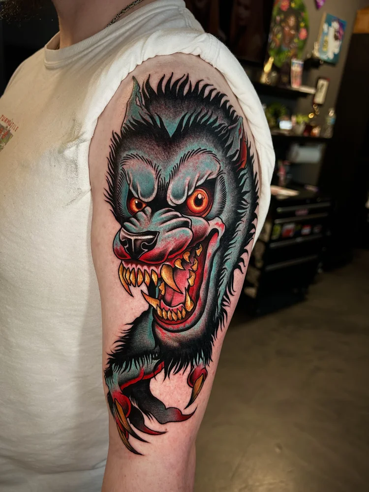 Snarling werewolf shoulder tattoo by Lexi at Electric Street Tattoo, Fort Lauderdale