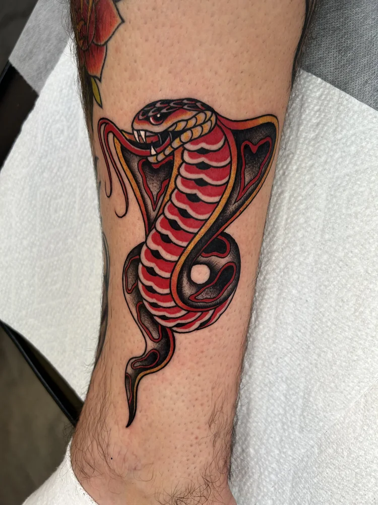 Red cobra tattoo by Lexi at Electric Street Tattoo, Fort Lauderdale
