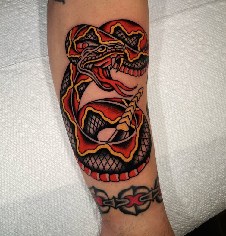 American Traditional coiled snake with chain tattoo by Nick at Electric Street Tattoo, Fort Lauderdale