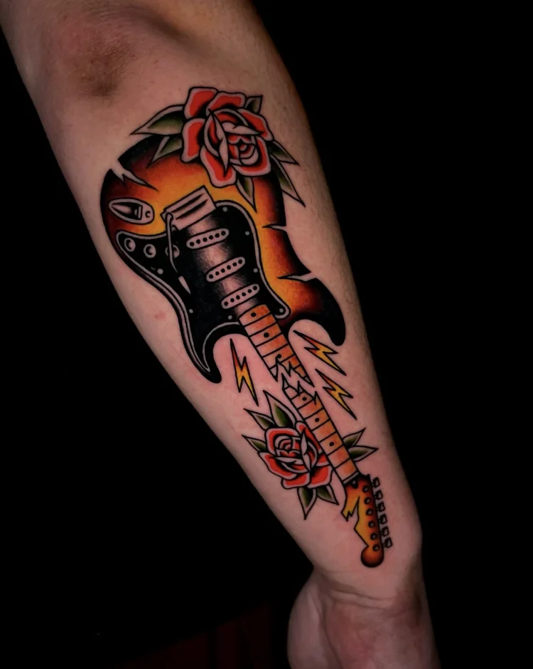 American Traditional electric guitar with flowers tattoo by Nick at Electric Street Tattoo, Fort Lauderdale