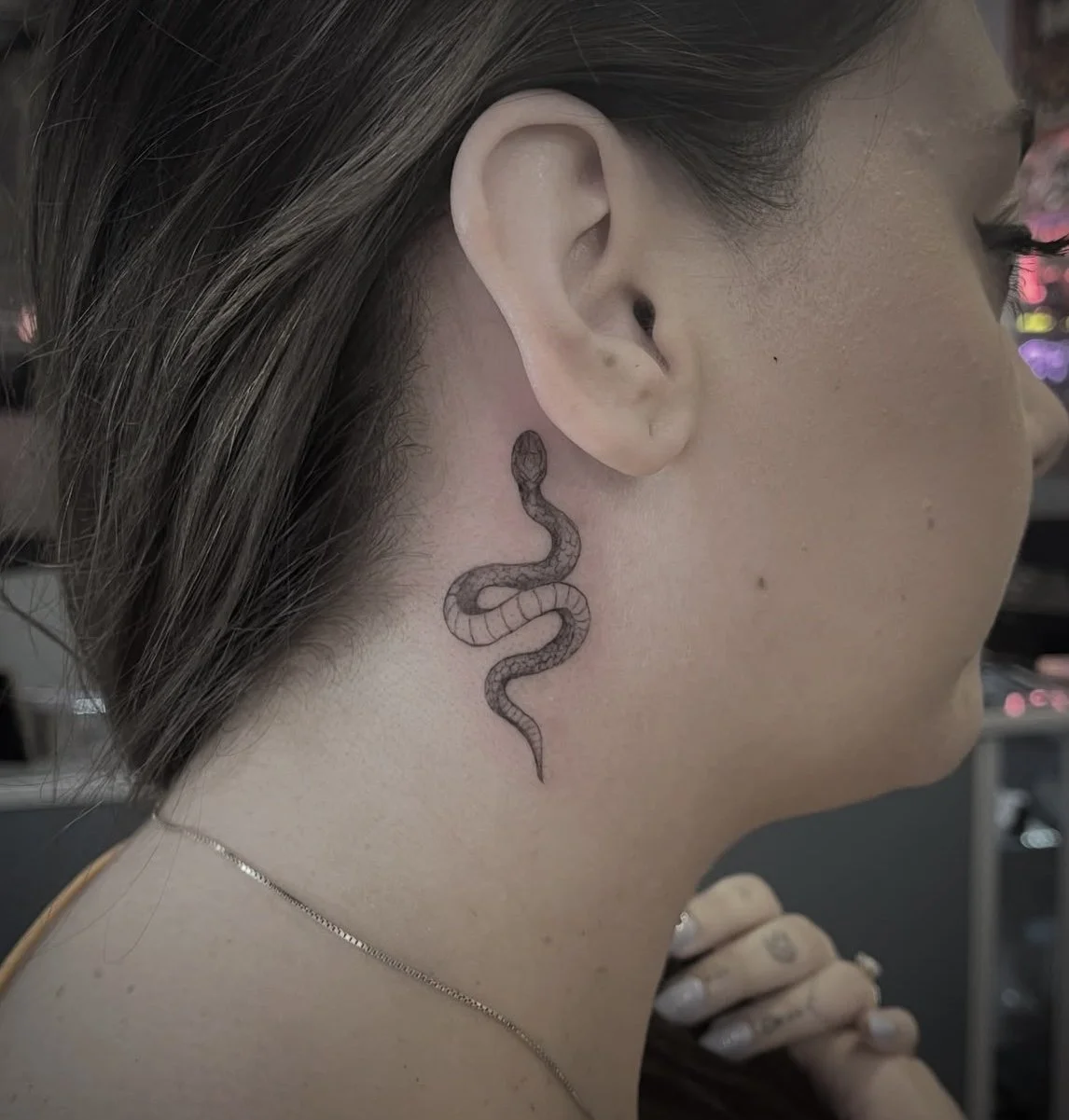 Woman's Neck Tattoo