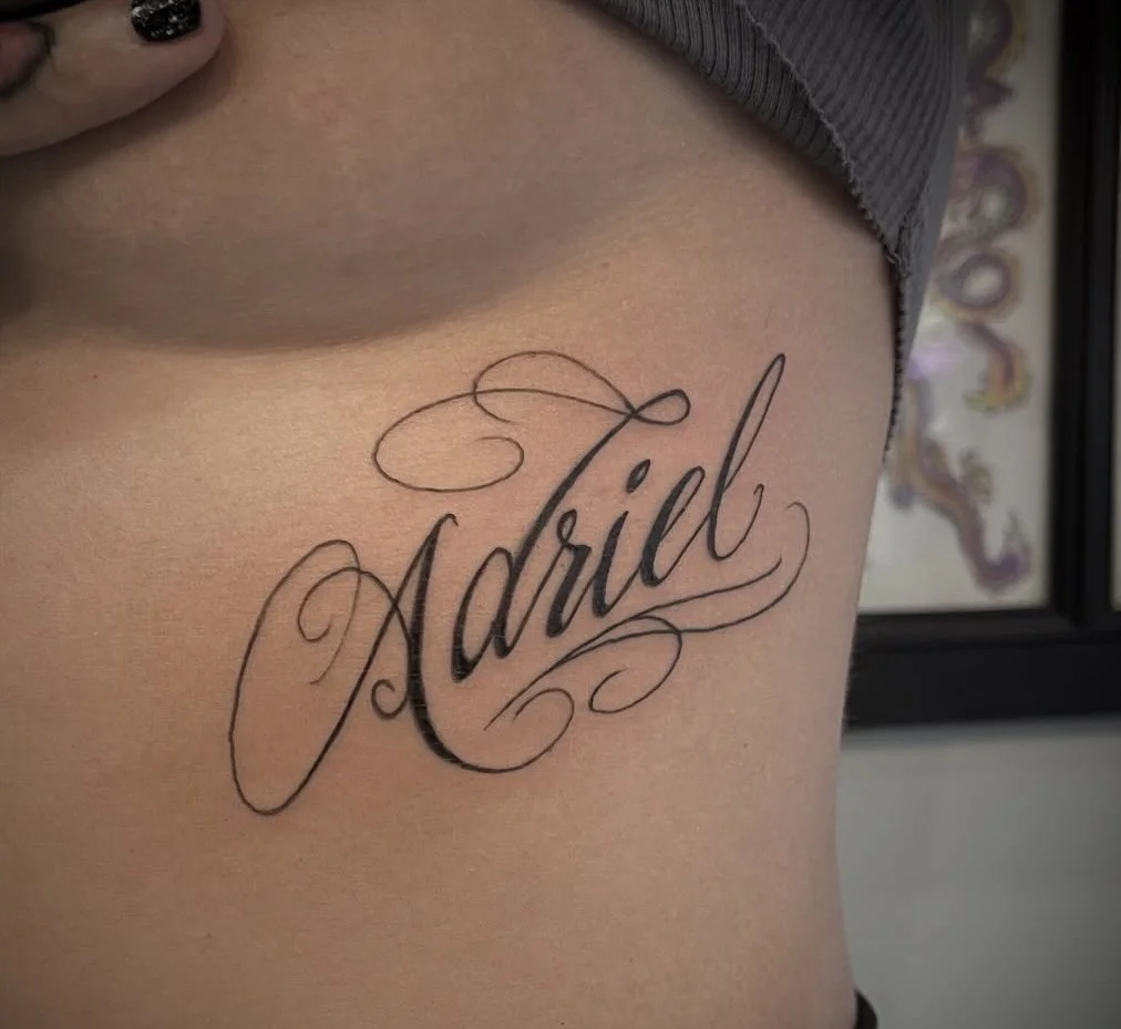 Fancy Script Neck Tattoo