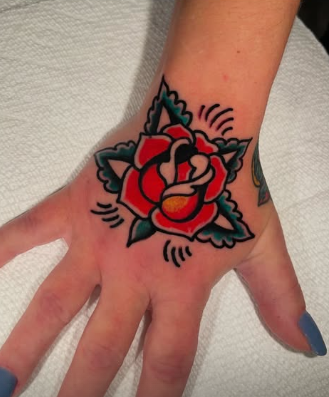 American Traditional red rose tattoo on the hand by Josh at Electric Street Tattoo, Fort Lauderdale