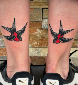 American Traditional matching swallows on both legs tattoo by Josh at Electric Street Tattoo, Fort Lauderdale