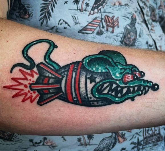 American Traditional rocket with a monster face tattoo by Josh at Electric Street Tattoo, Fort Lauderdale